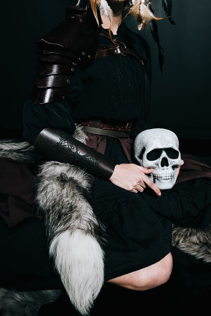 A stark series of moody black and white photos showing a skull prop against a dark background with shadowy elements.
