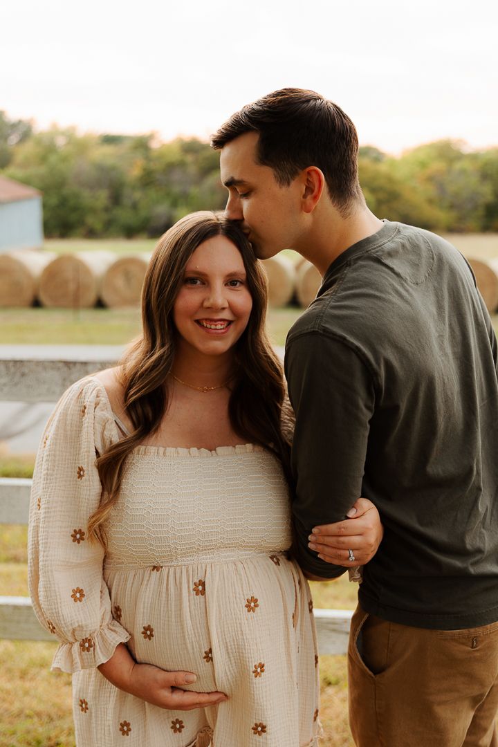 Romantic couple in a sunlit field share tender moments in a series of photos while wearing casual attire.