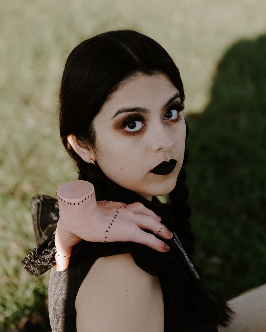 Gothic style portrait series with dark makeup and dotted line details in dramatic outdoor lighting.