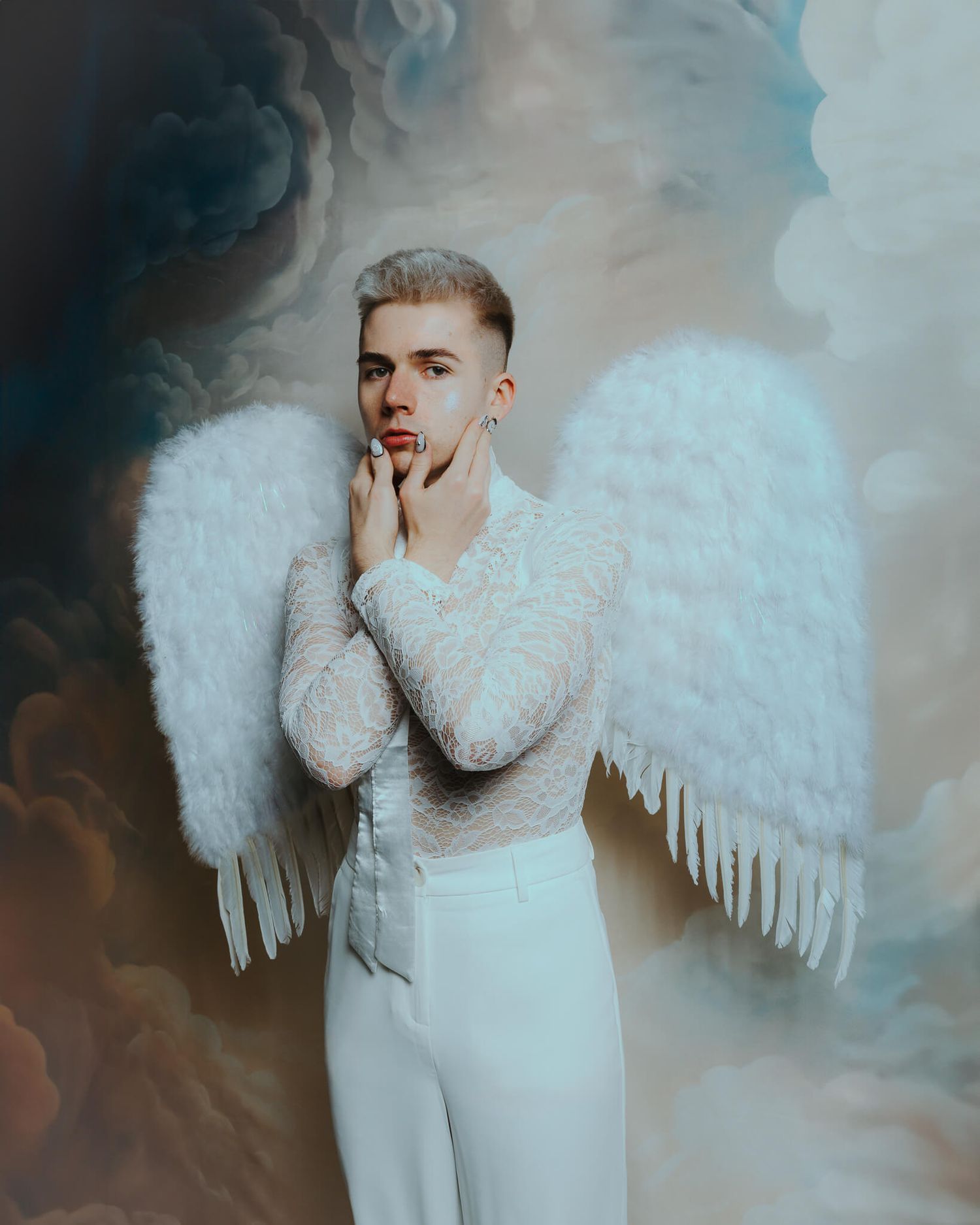 A dreamy portrait series featuring an ethereal figure in white with angel wings against a cloudy blue background.