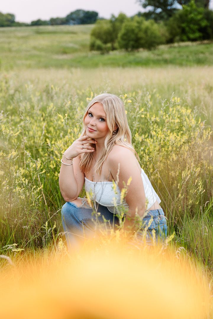 Golden wildflowers sway in a sunny meadow during a summer photoshoot.