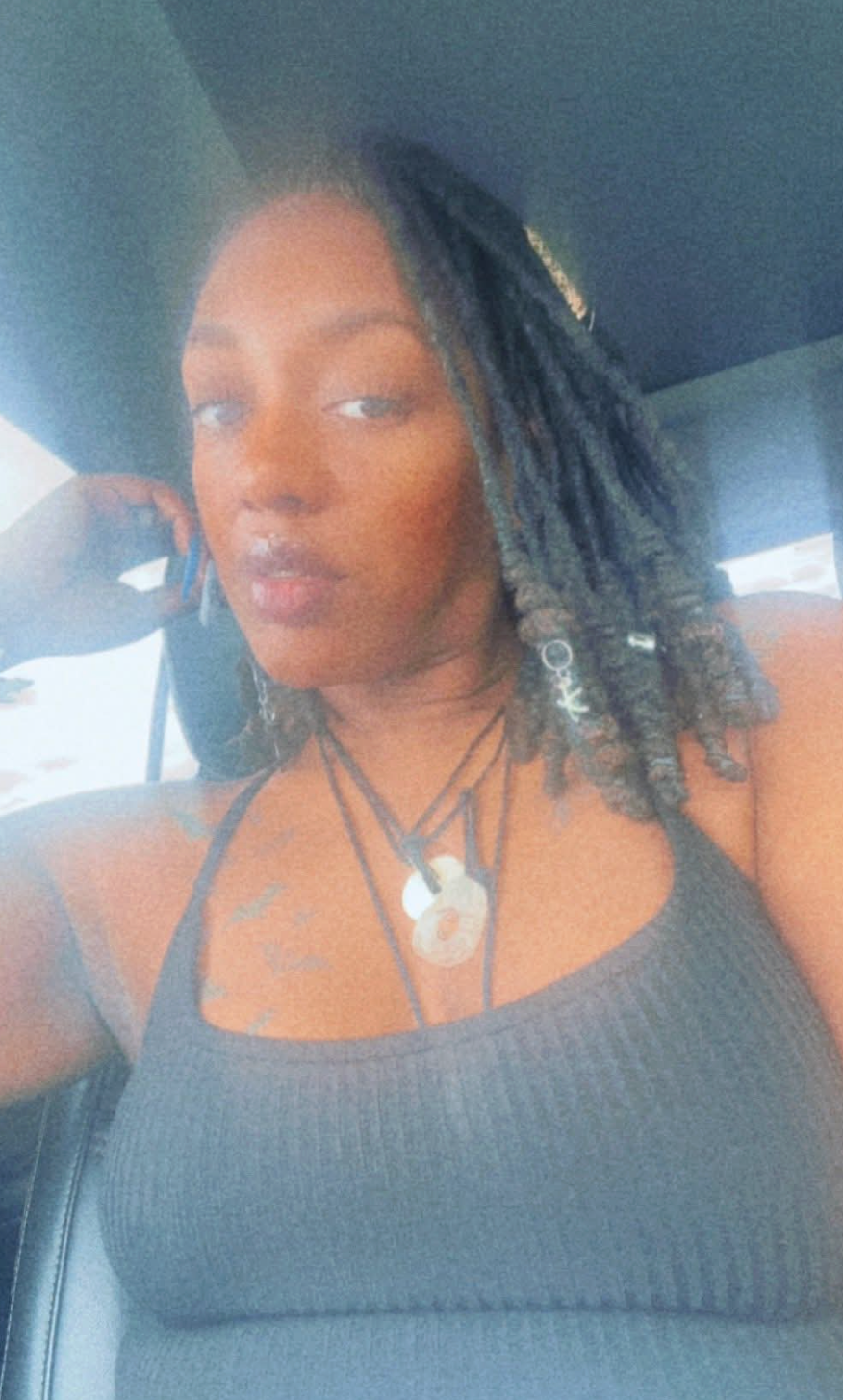 A series of selfies taken in a car showing someone with dark locs hairstyle wearing a black tank top.
