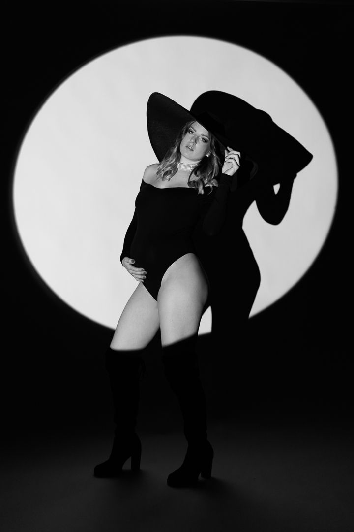 A sequence of black and white artistic photos showing silhouetted dancers performing elegant movements against a light background.