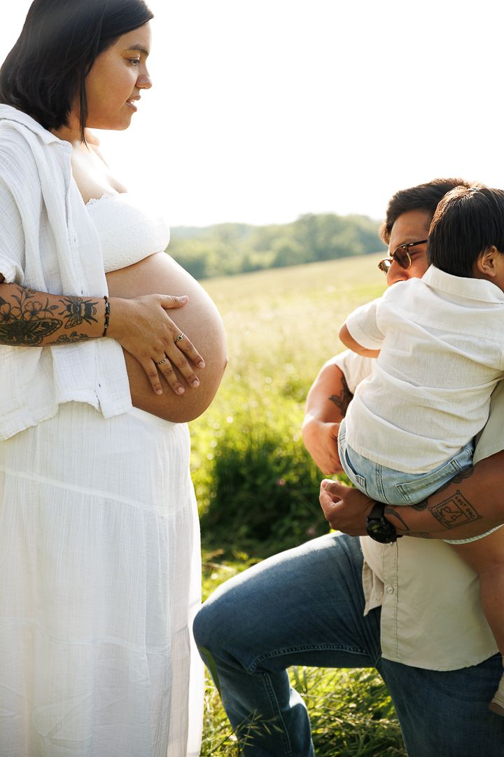 Side views of maternity photos showing embrace and connection during outdoor photo session.