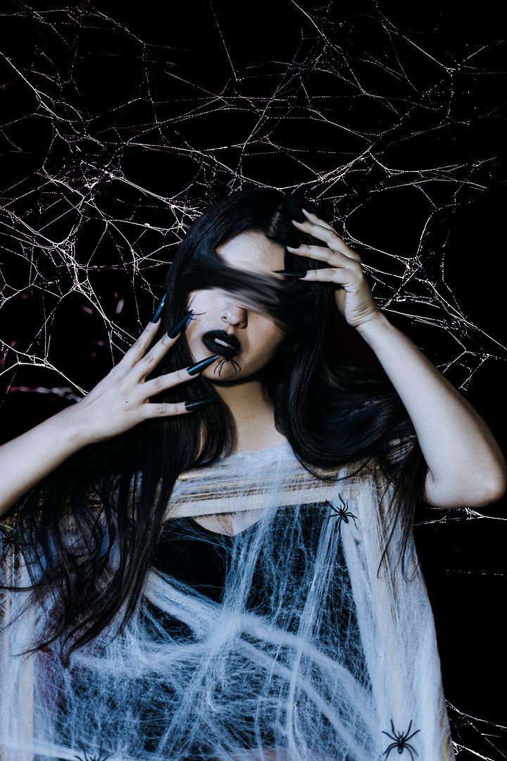 Dark gothic portrait series with cobwebs and dramatic poses in monochromatic style.