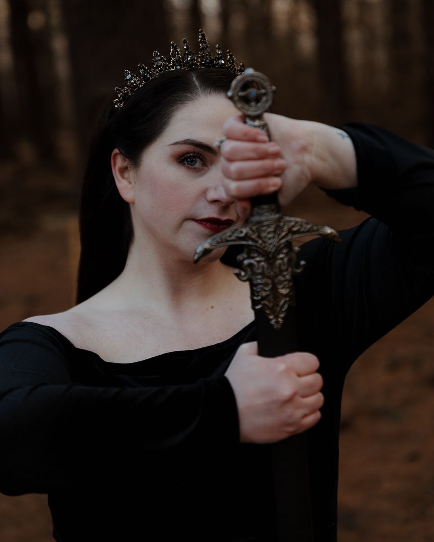 Artistic portrait series with dramatic hand gestures in dark forest setting.