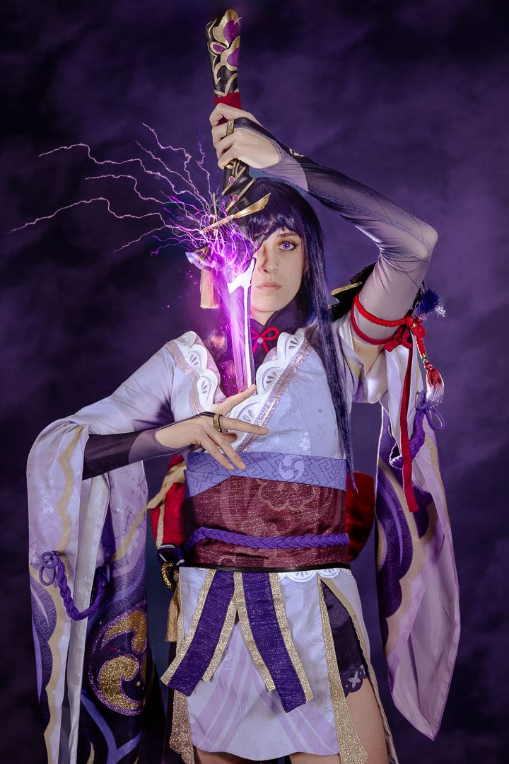 Character in traditional white kimono wielding glowing purple sword in dramatic battle poses.