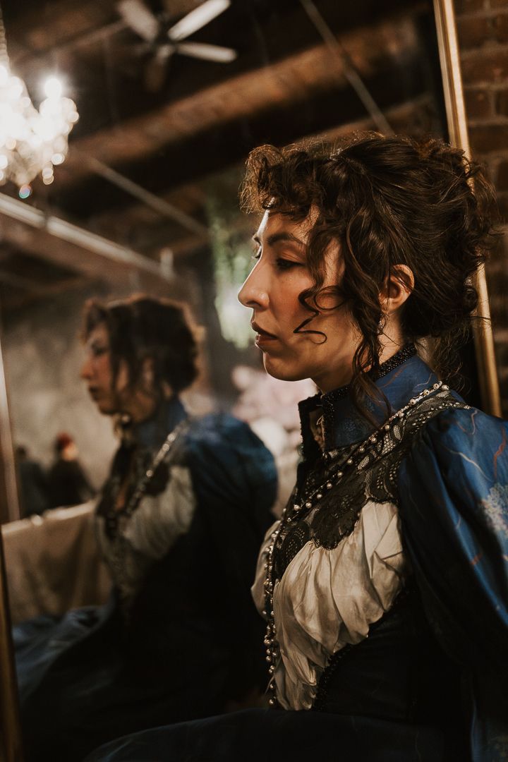 Moody portrait series in period costume with dramatic lighting.