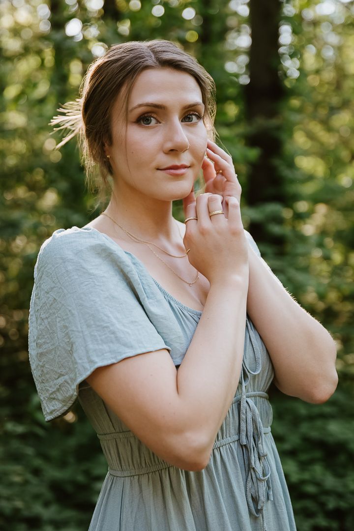 Series of outdoor portrait shots captured in soft natural lighting with forest bokeh in the background.