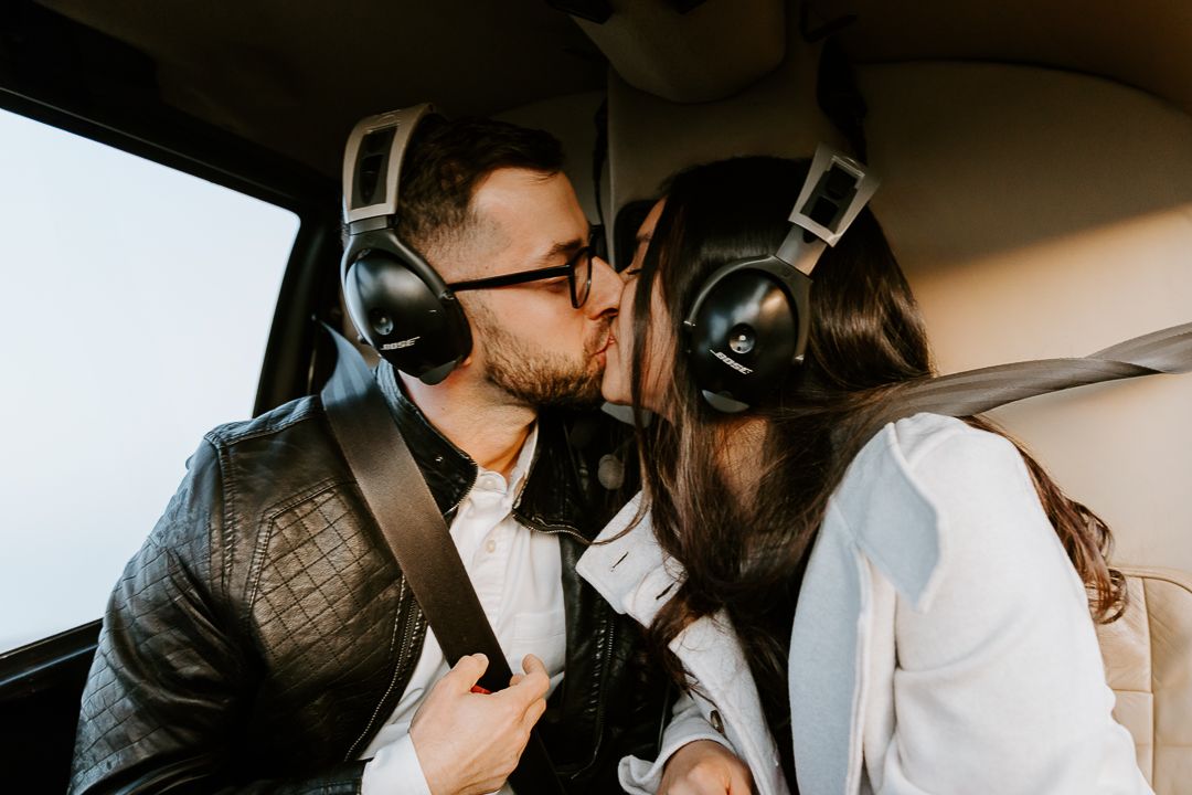 Close-up shots of a couple in intimate poses against a dark background during a photoshoot.