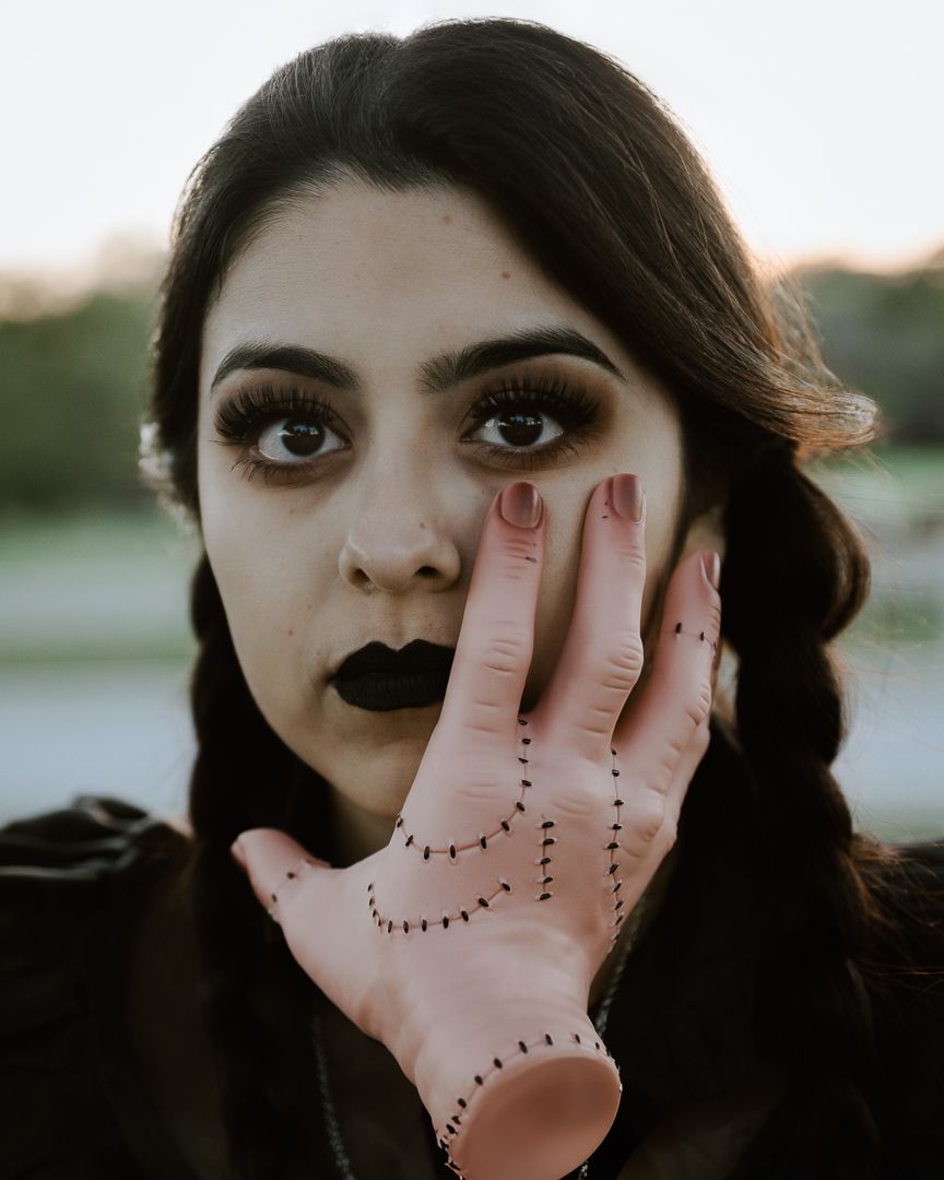 A sequence of hands held up against a light background with dotted line patterns drawn on the palm.