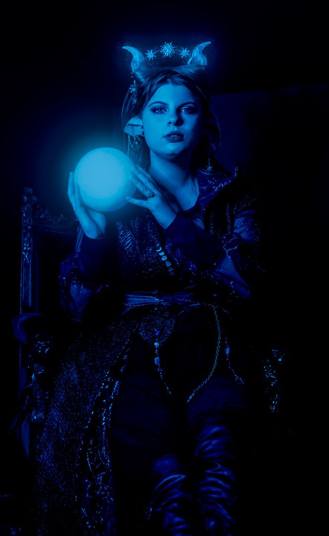 Moody blue-tinted portrait series with dramatic lighting and vintage styling.