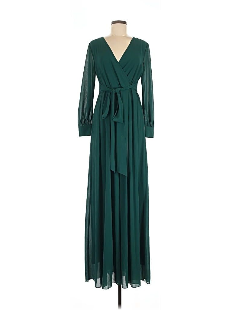 Emerald green chiffon maxi dress with a surplice V-neckline, long sheer sleeves, and a tie waist, displayed on a mannequin.