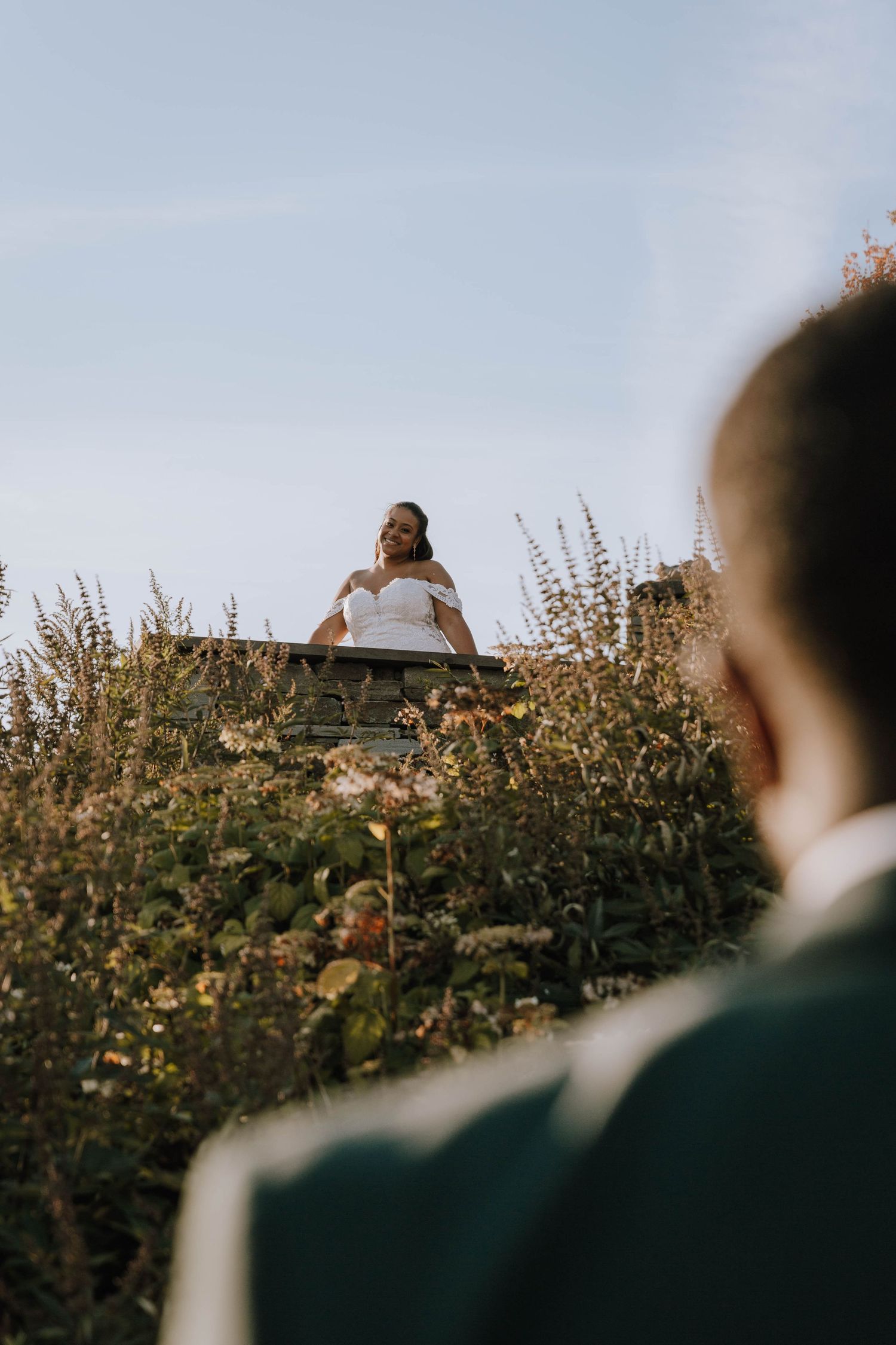 Bride looking down at Groom like Juliette looking down at Romeo during golden hour