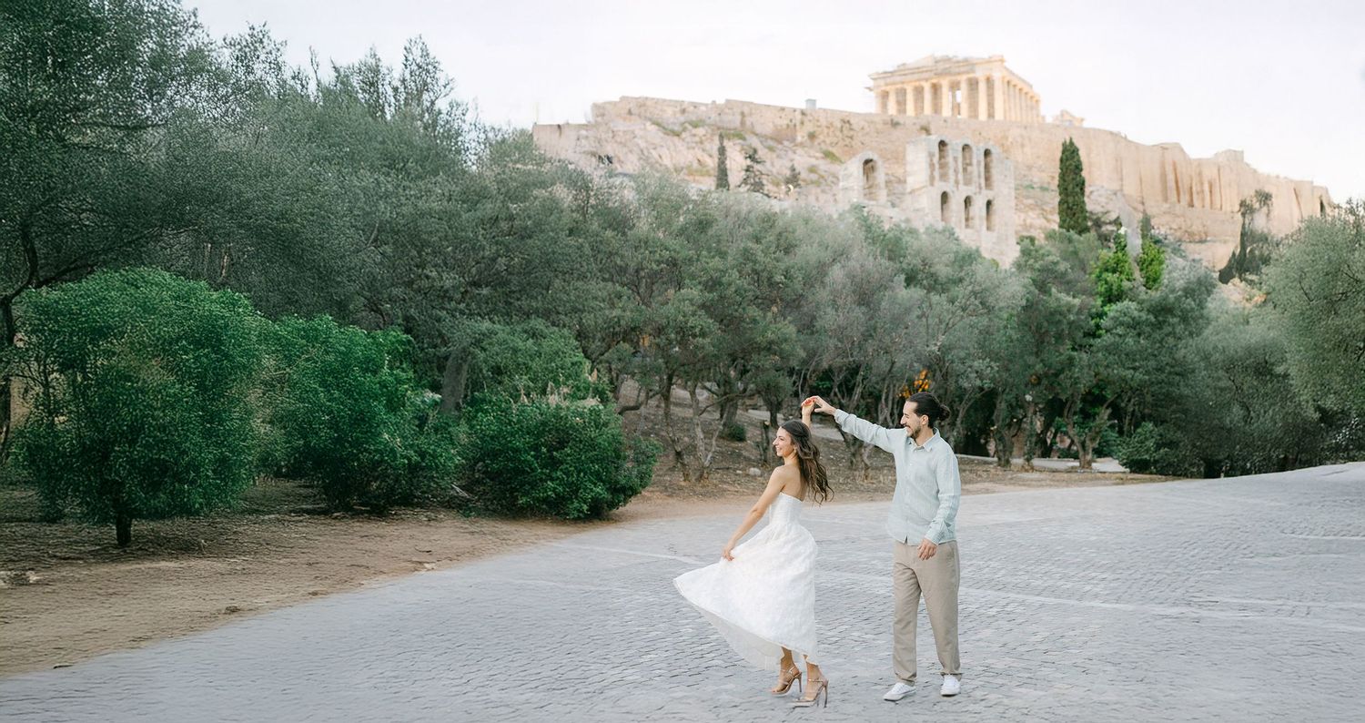 Editorial couple photoshoot in Athens, romantic portrait in soft natural light with Acropolis views