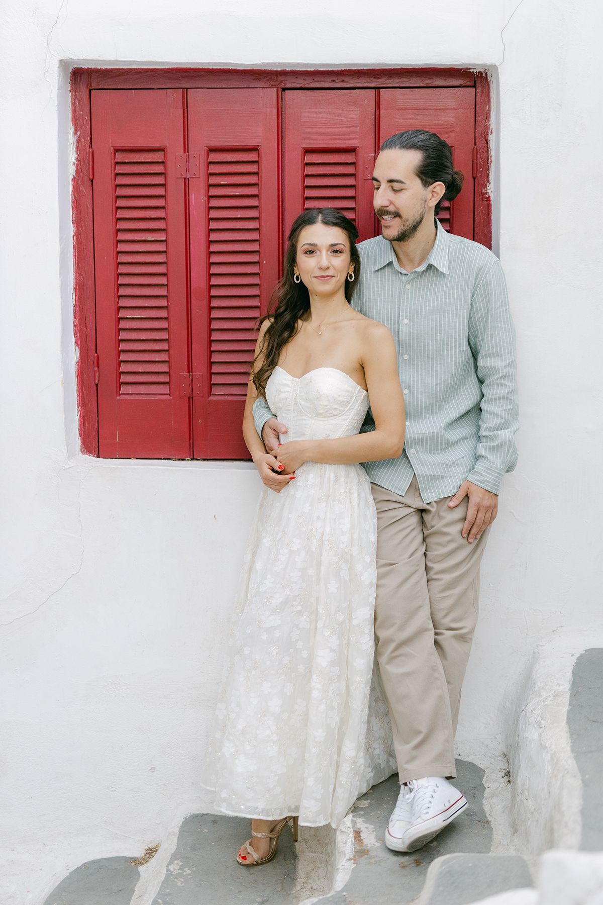 Couple photoshoot in Plaka Athens, natural walking portraits in warm stone streets.
