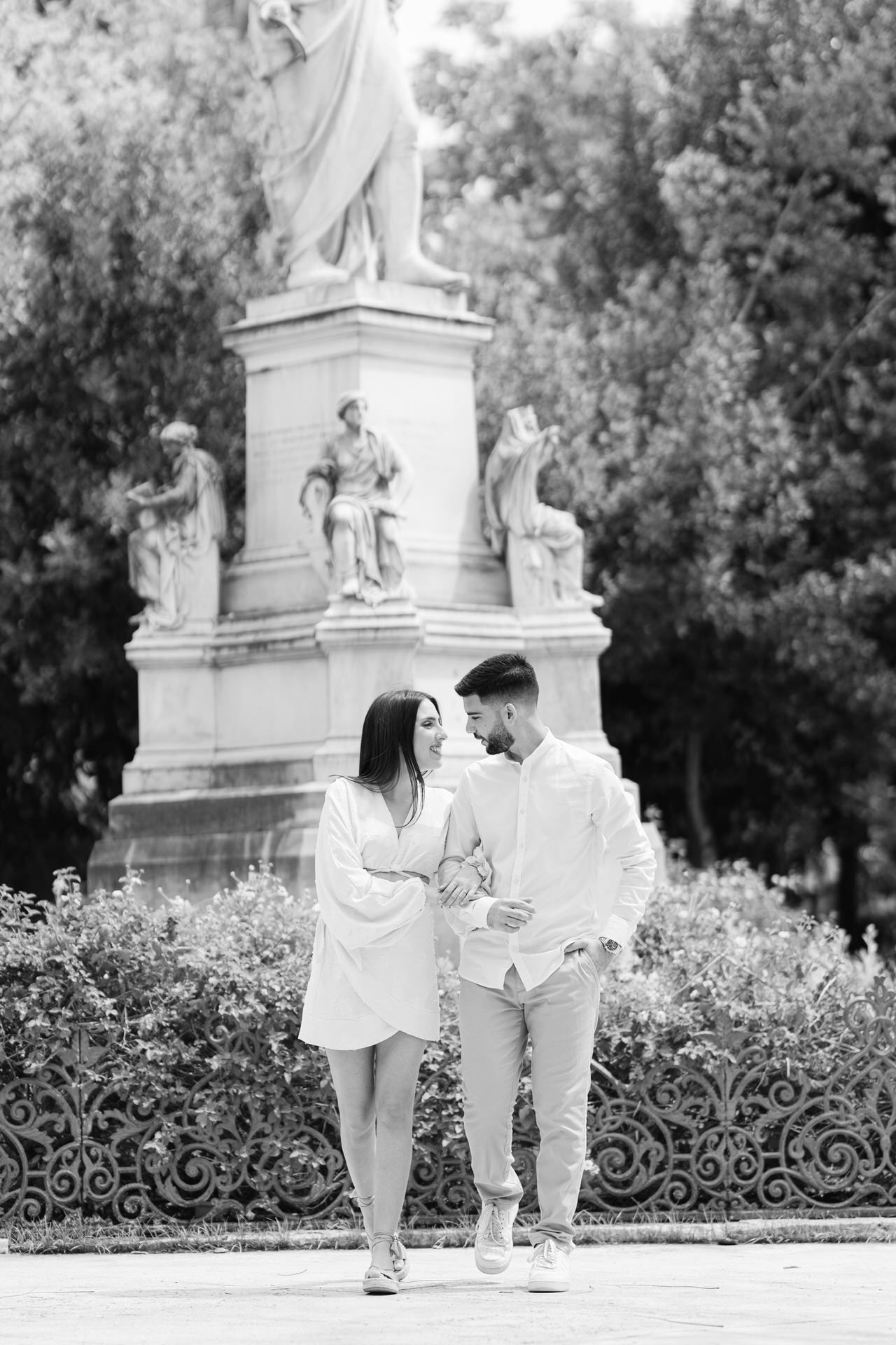 Couple walking in Plaka Athens, romantic editorial portrait in soft natural light.