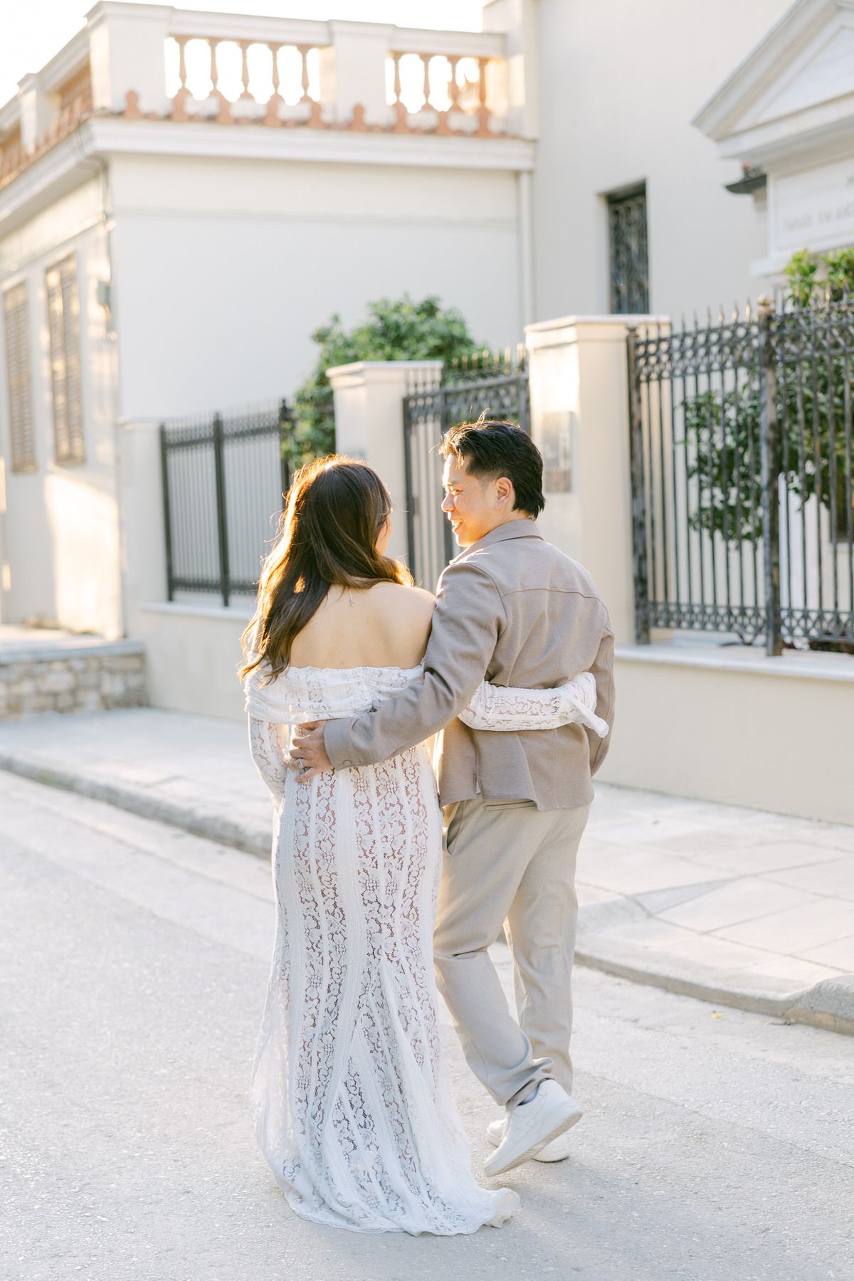 Couple walking through Plaka in Athens during a romantic vacation photoshoot