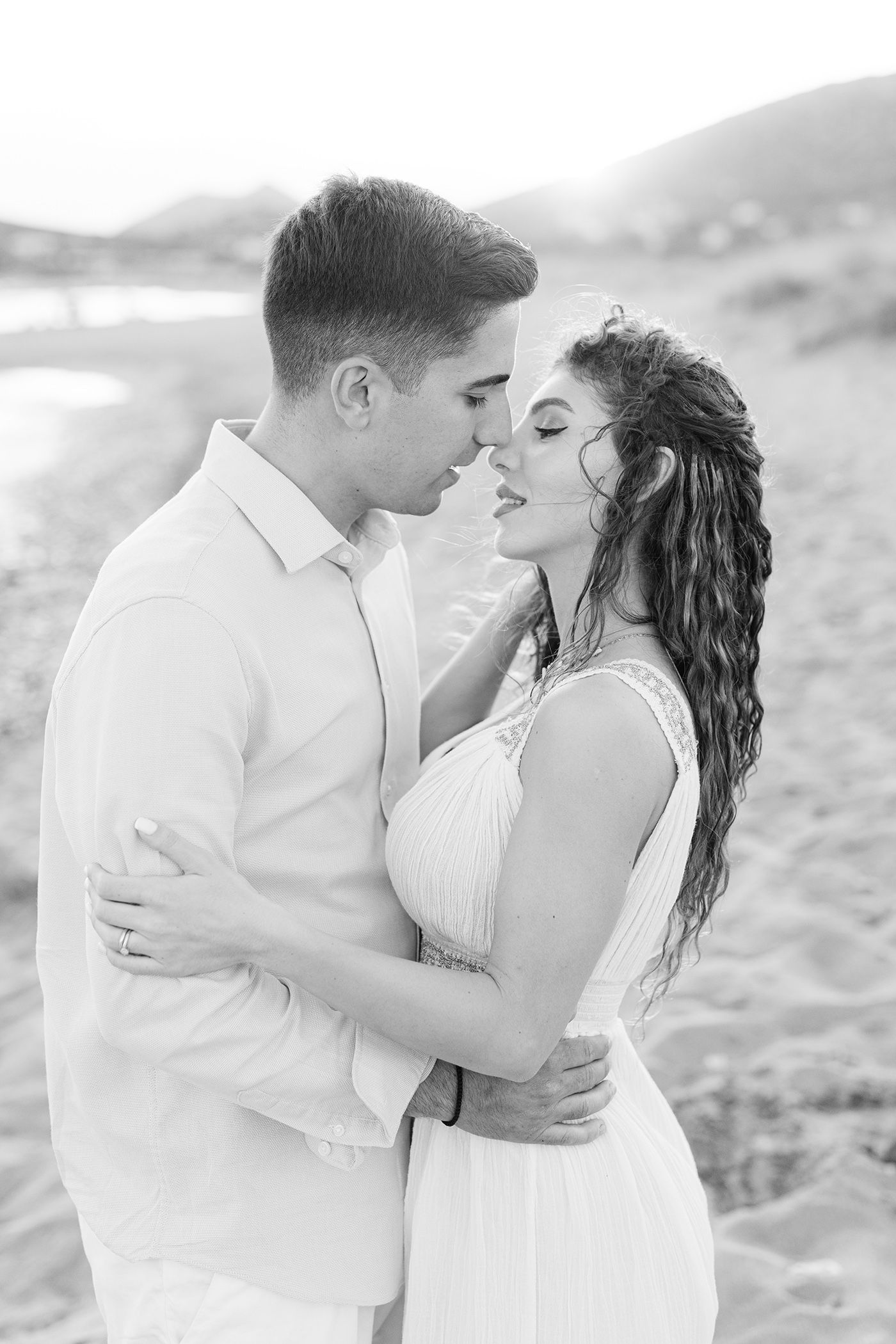 Couple photoshoot on the Athens Riviera at golden hour, editorial romantic portrait by the sea.
