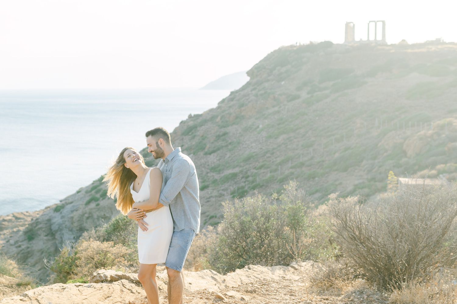 Couple photoshoot in Athens Riviera at golden hour, editorial travel portrait session.