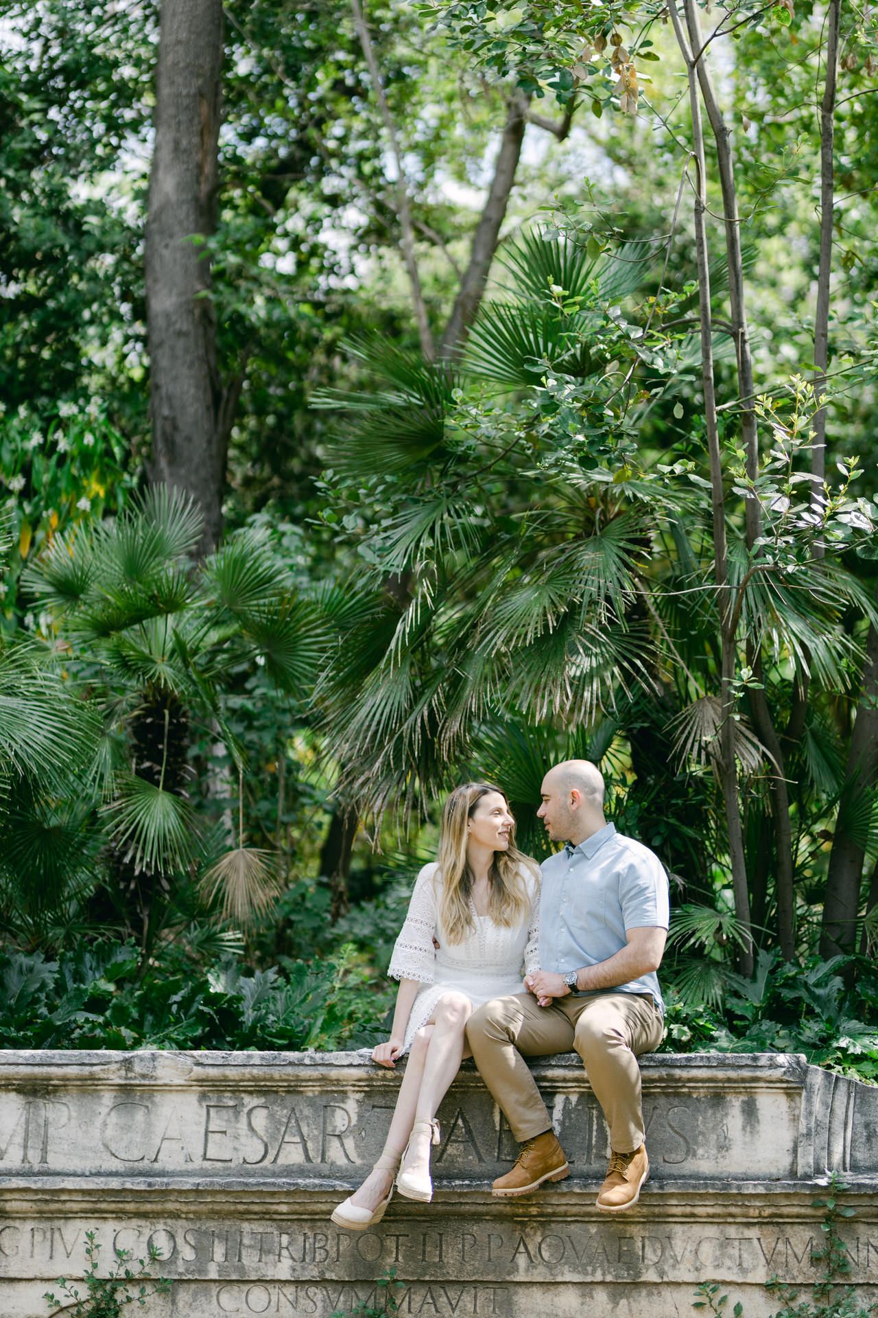 National Garden photoshoot in Athens, romantic couple portraits in soft shaded light.