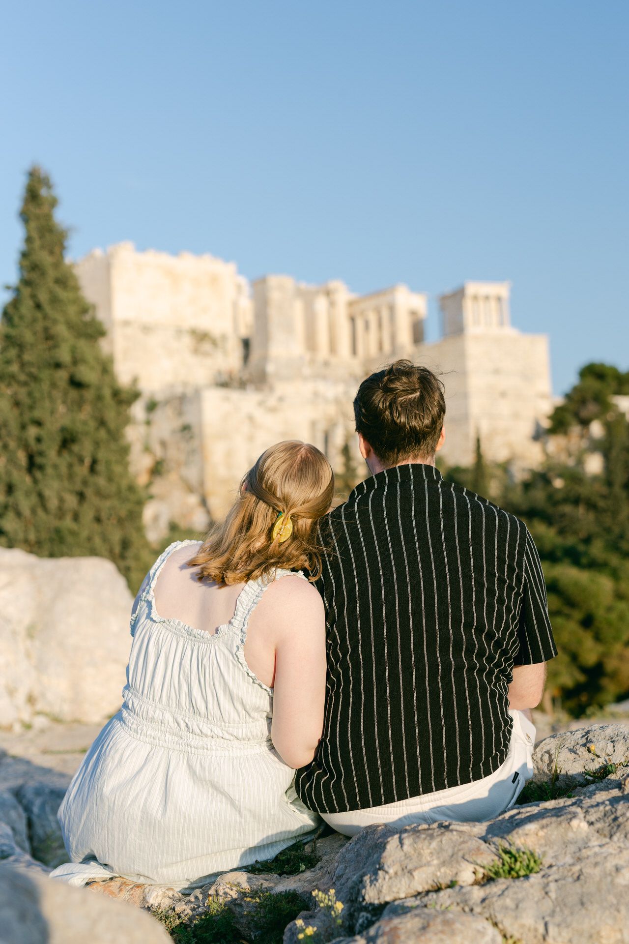 Athens couple portrait with iconic acropolis backdrop and warm afternoon light