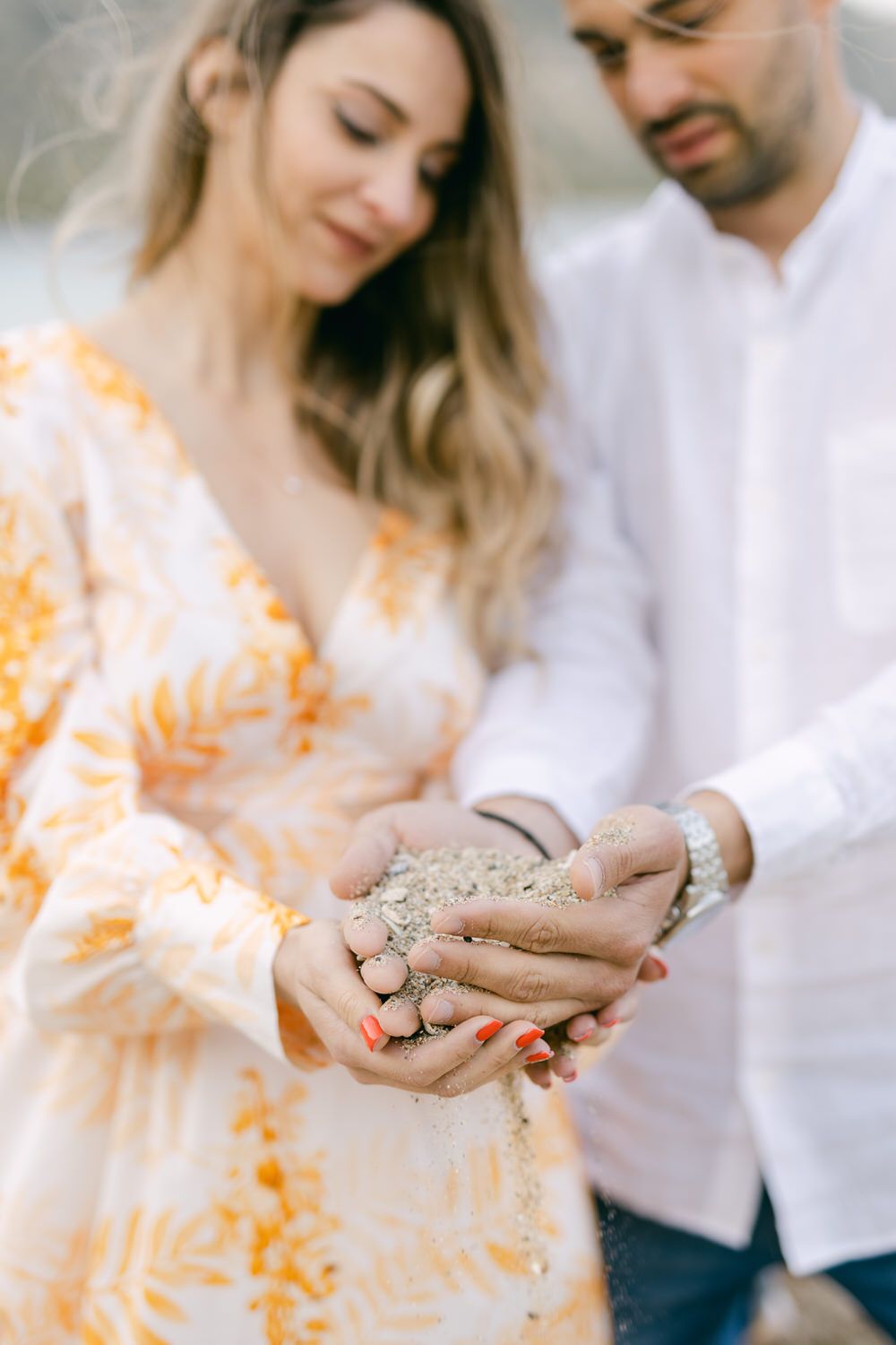 Athens Riviera couple photoshoot at sunset, editorial portraits with sea light and soft tones.