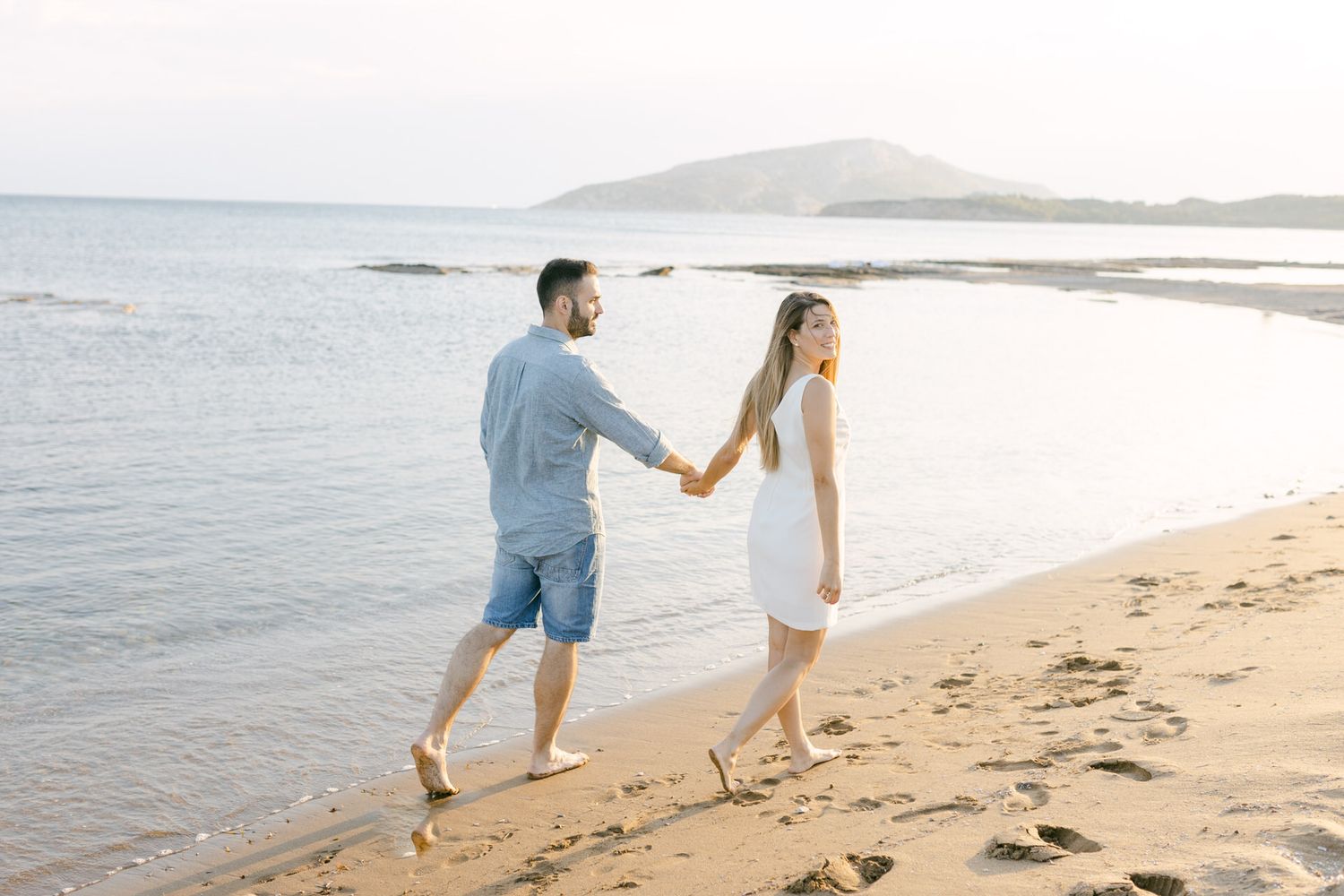Couple photoshoot on the Athens Riviera at golden hour, editorial romantic portrait by the sea.