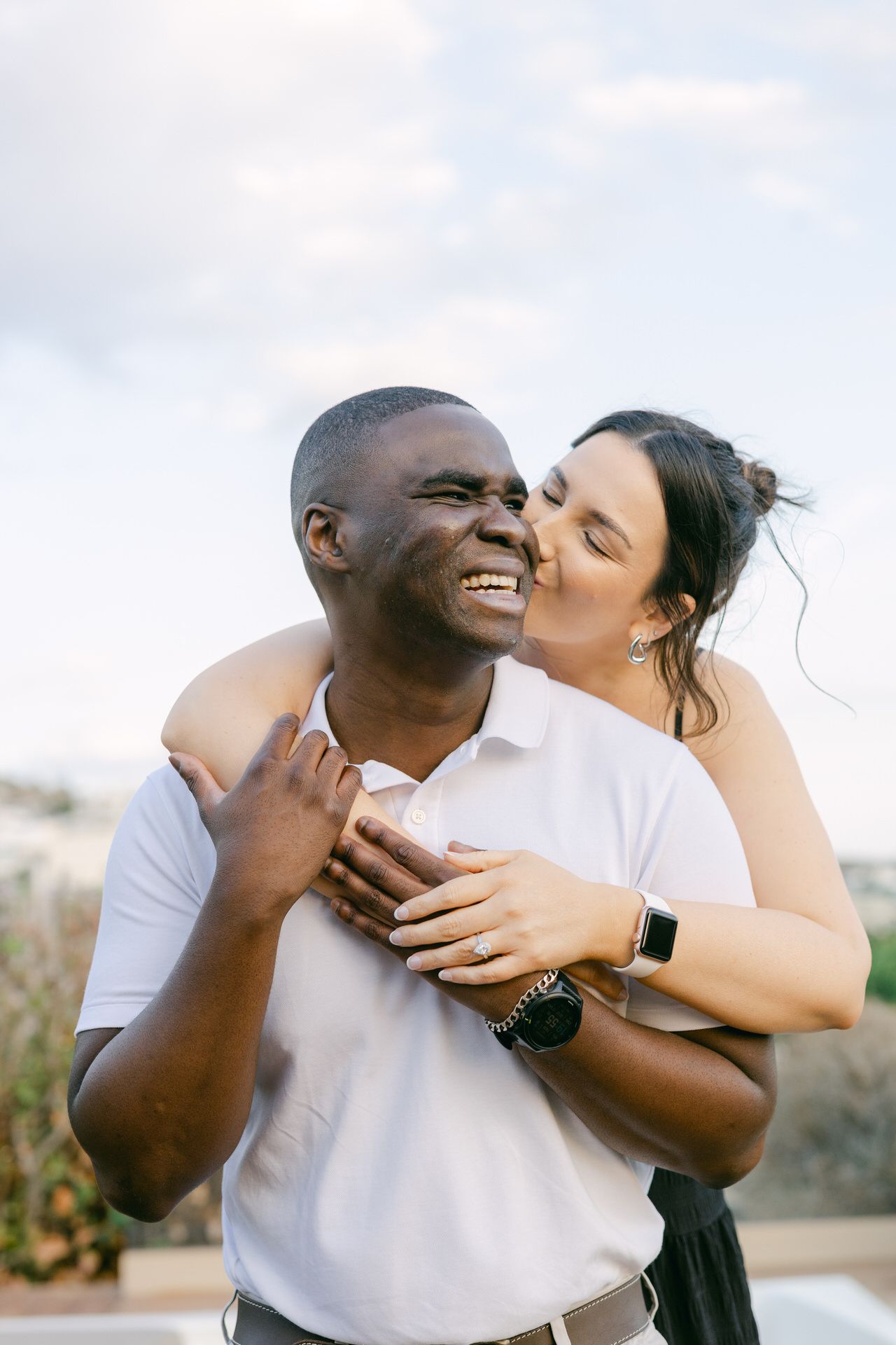 Private couple lifestyle session indoors in Athens, soft window light and intimate mood.