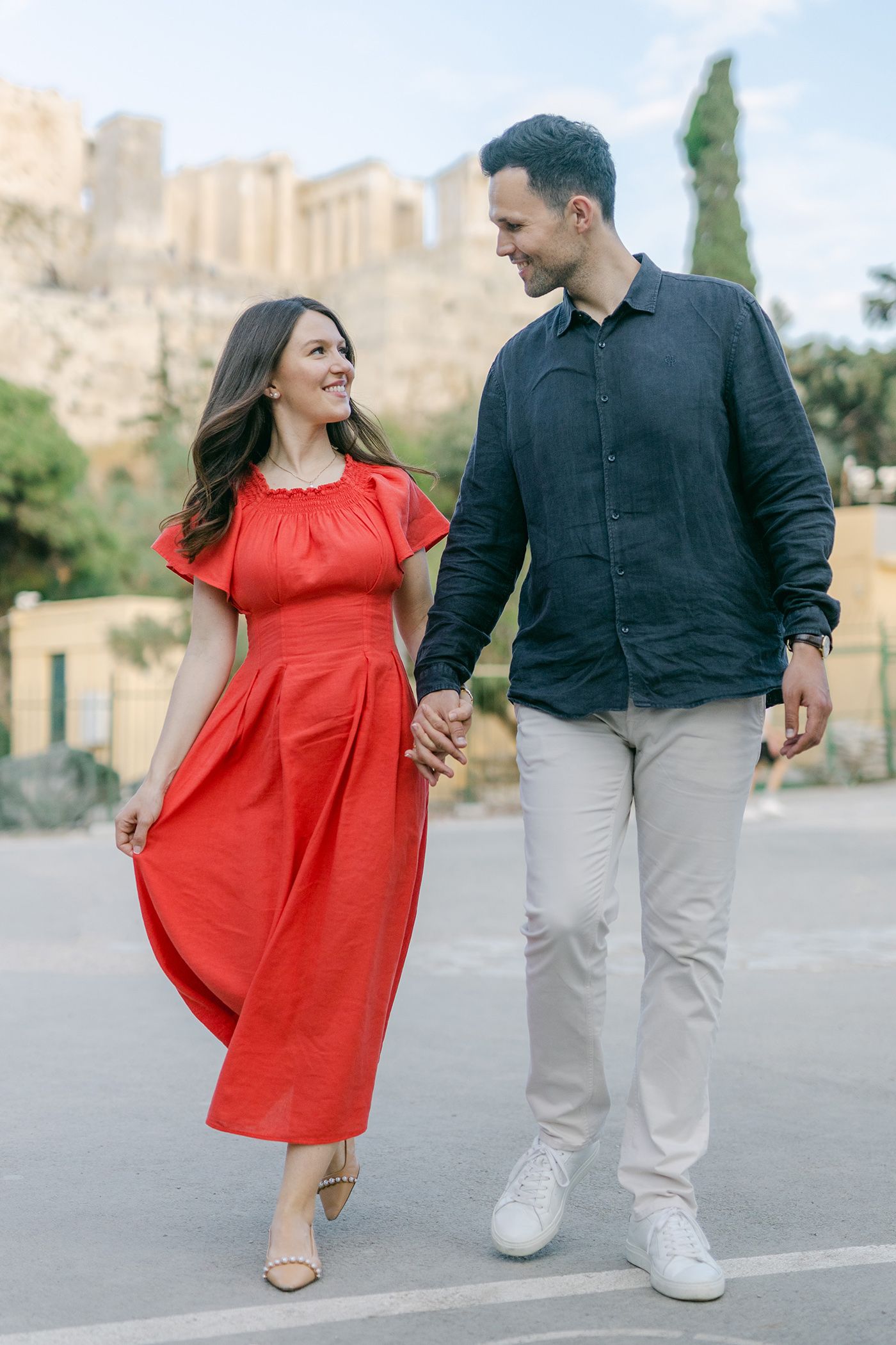 Couple photoshoot near Acropolis viewpoints in Athens, iconic backdrop in warm light.