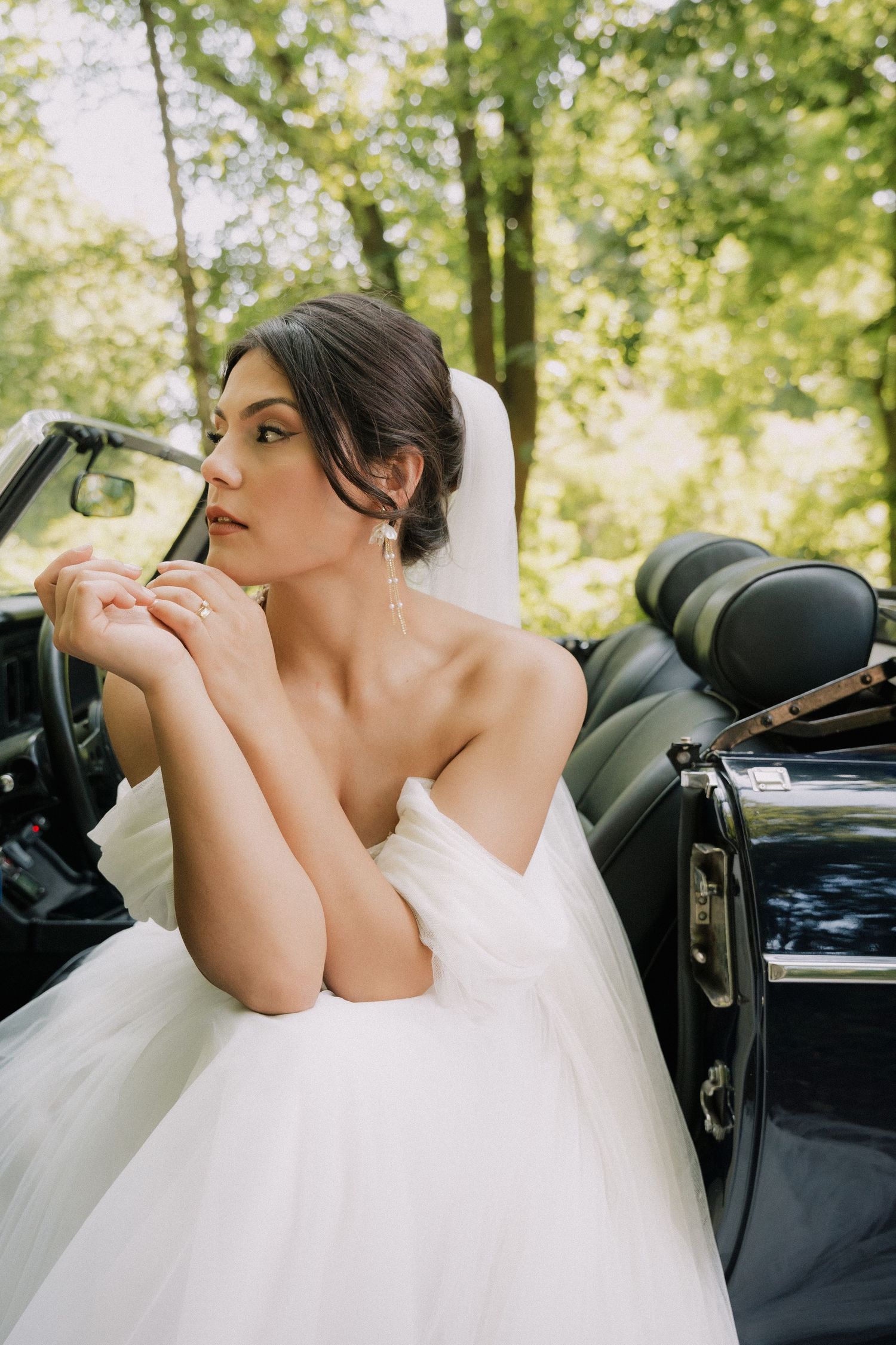 luxury destination bride in an old car