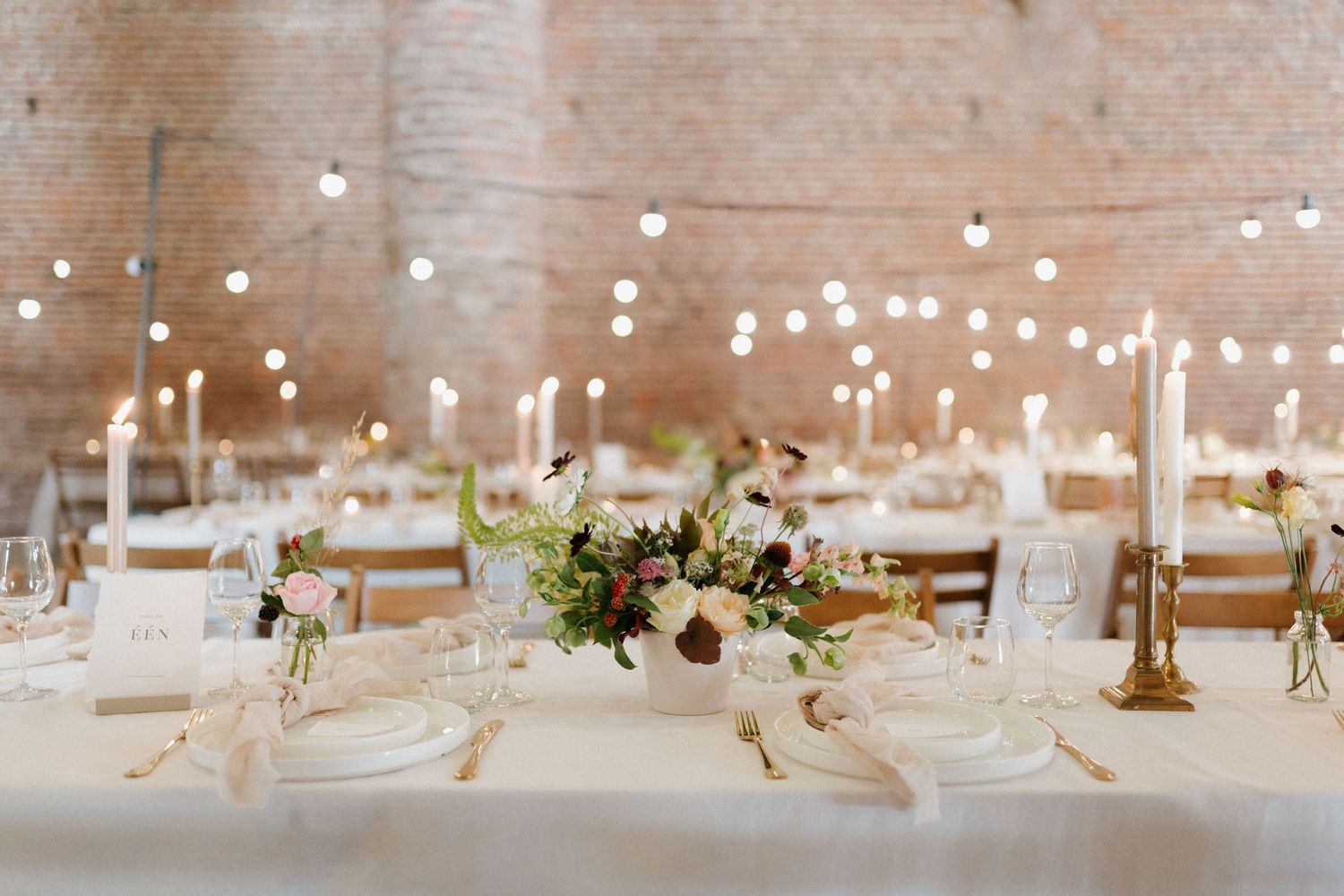 luxury wedding reception, Elegant photo of a table with soft flowers, creating a romantic and timeless atmosphere for a wedding or special e