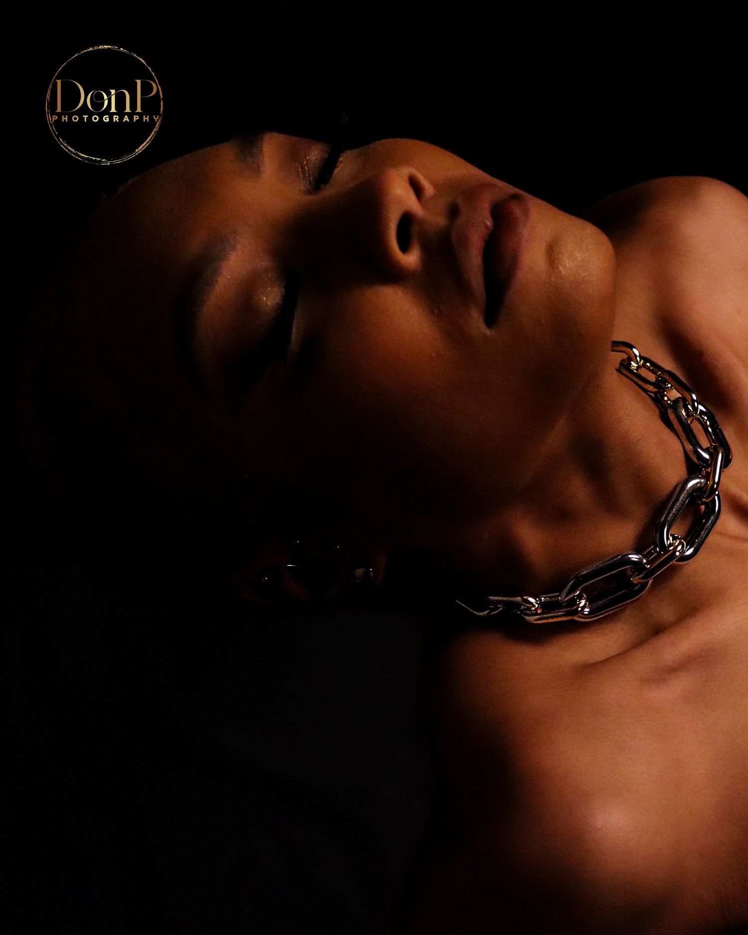Close-up boudoir photography portrait using soft focus and detail to emphasize mood, texture, and intimacy.