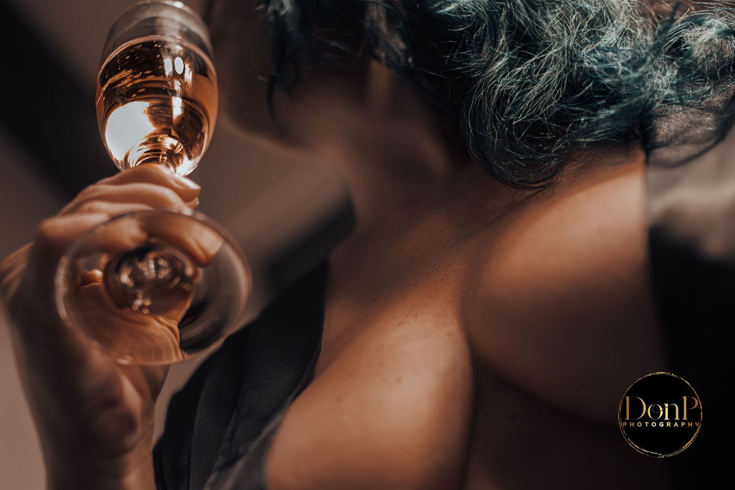 Intimate lifestyle detail featuring glassware and soft focus, using light and texture to suggest quiet atmosphere.