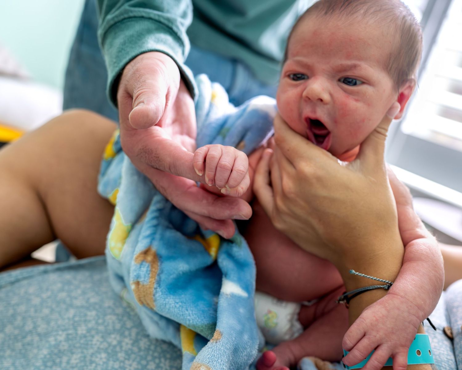Close-up sequence of tender newborn care moments showing gentle interactions and bonding.