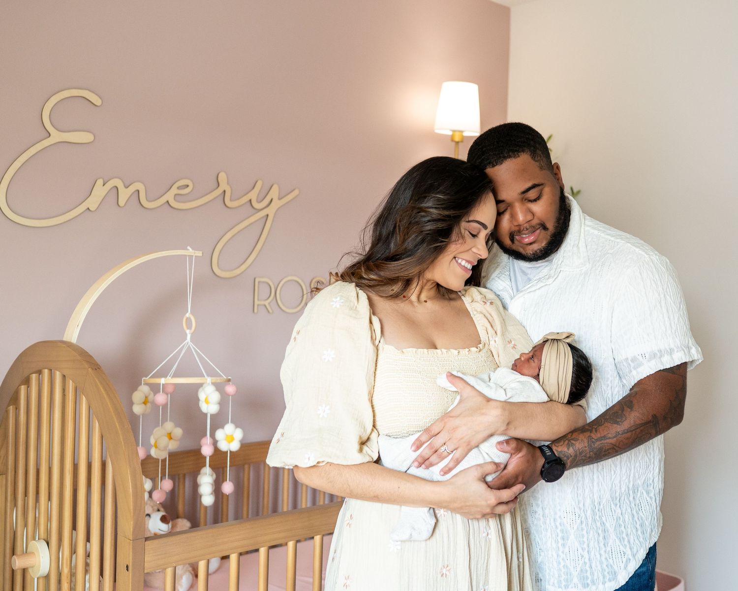 Tender nursery moments captured in a series of photos showing parents bonding with their newborn.