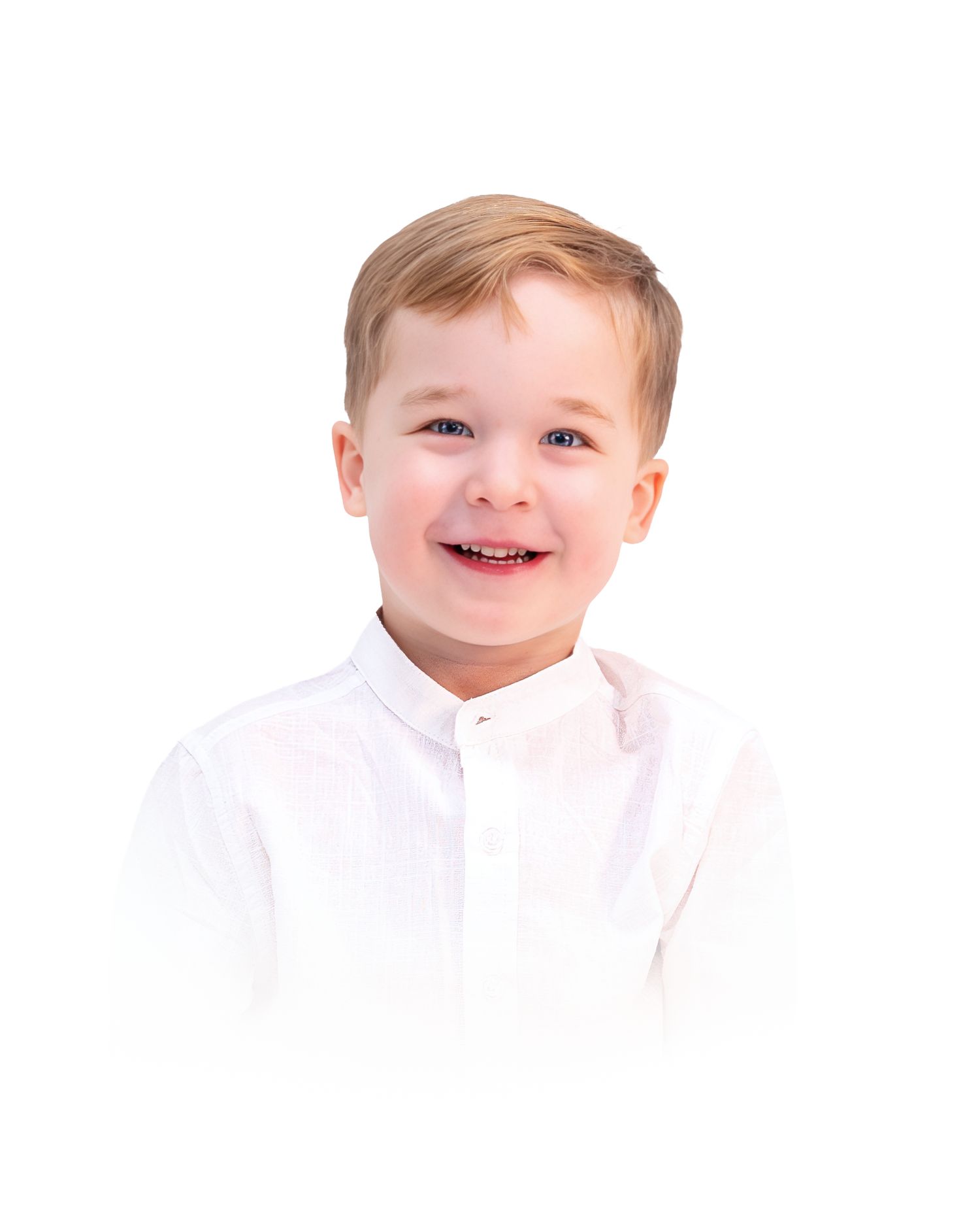 A young child with light hair wearing a white shirt smiles brightly at the camera.