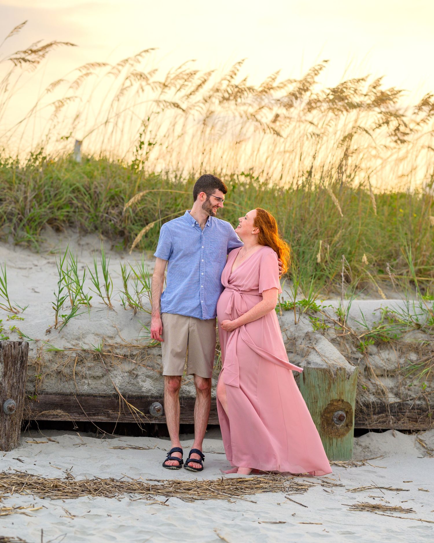 A hetero couple embraced on the beach