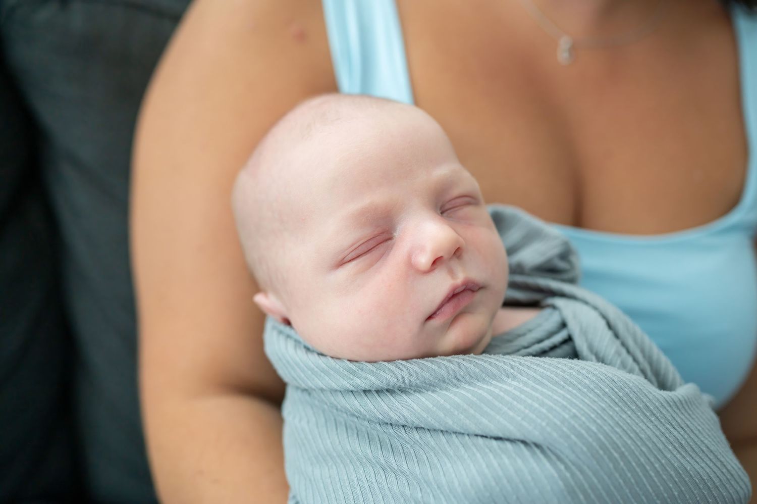 Close up of newborn baby boy face, he's sleeping