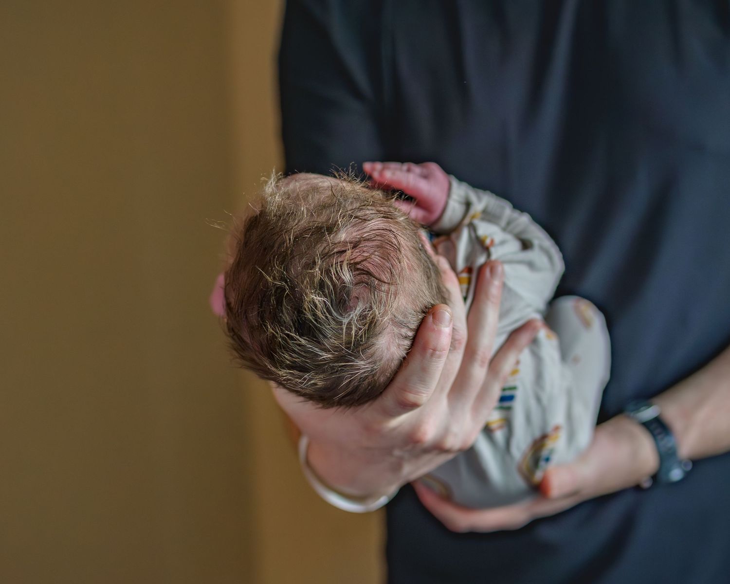 Series of hospital photos showing a newborn baby shortly after birth.
