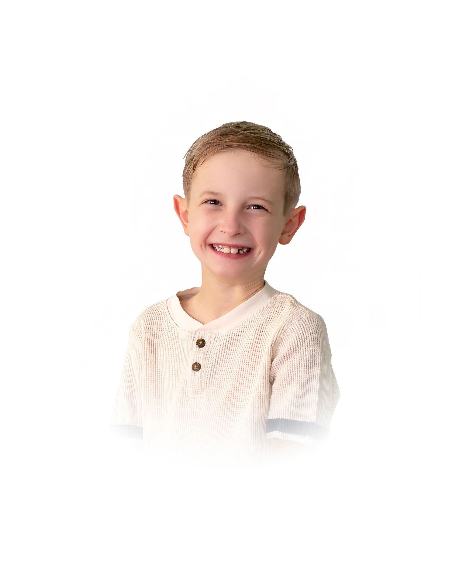 A child in a white henley shirt smiles warmly at the camera with a bright, cheerful expression.