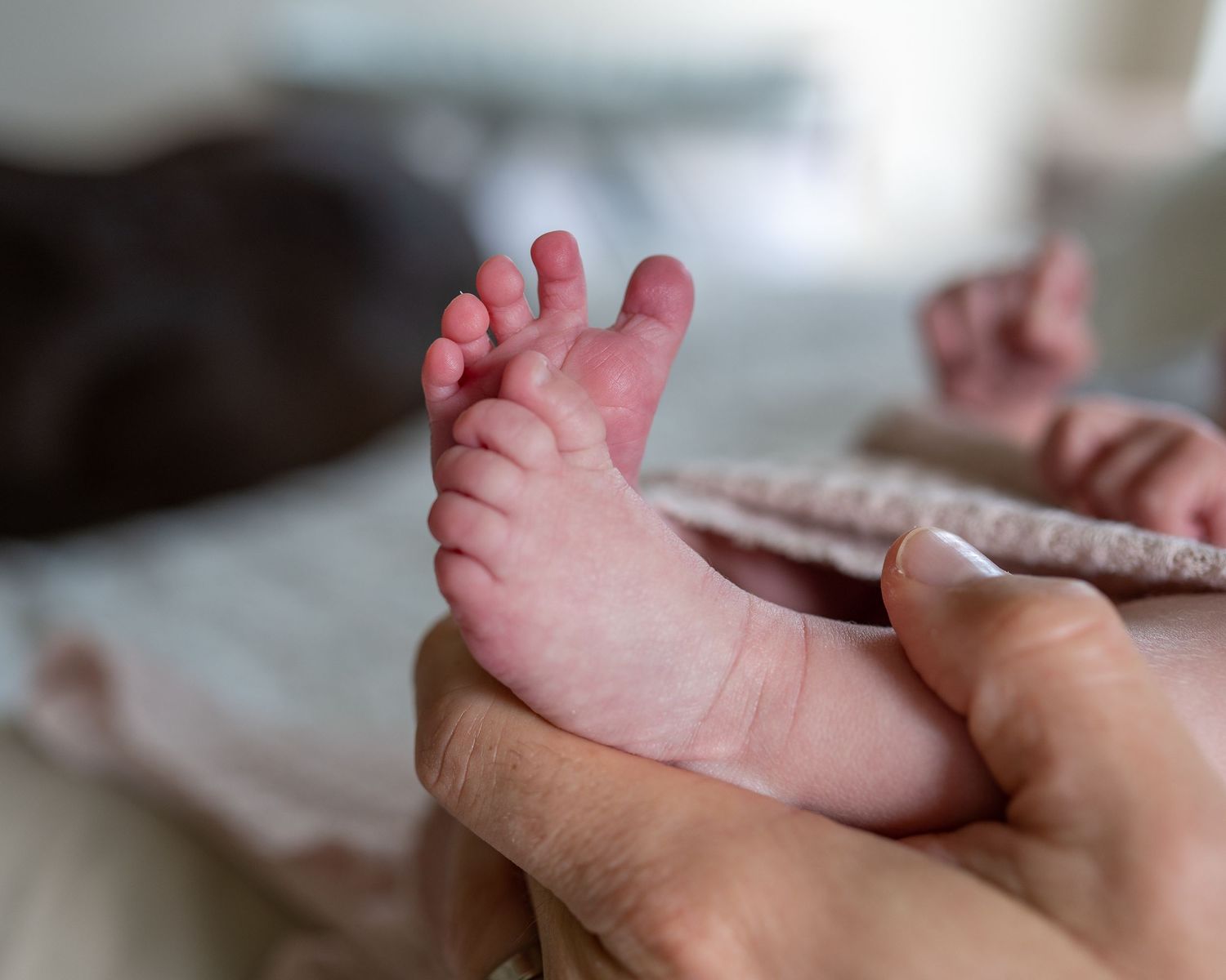 Close up of newborn baby toes