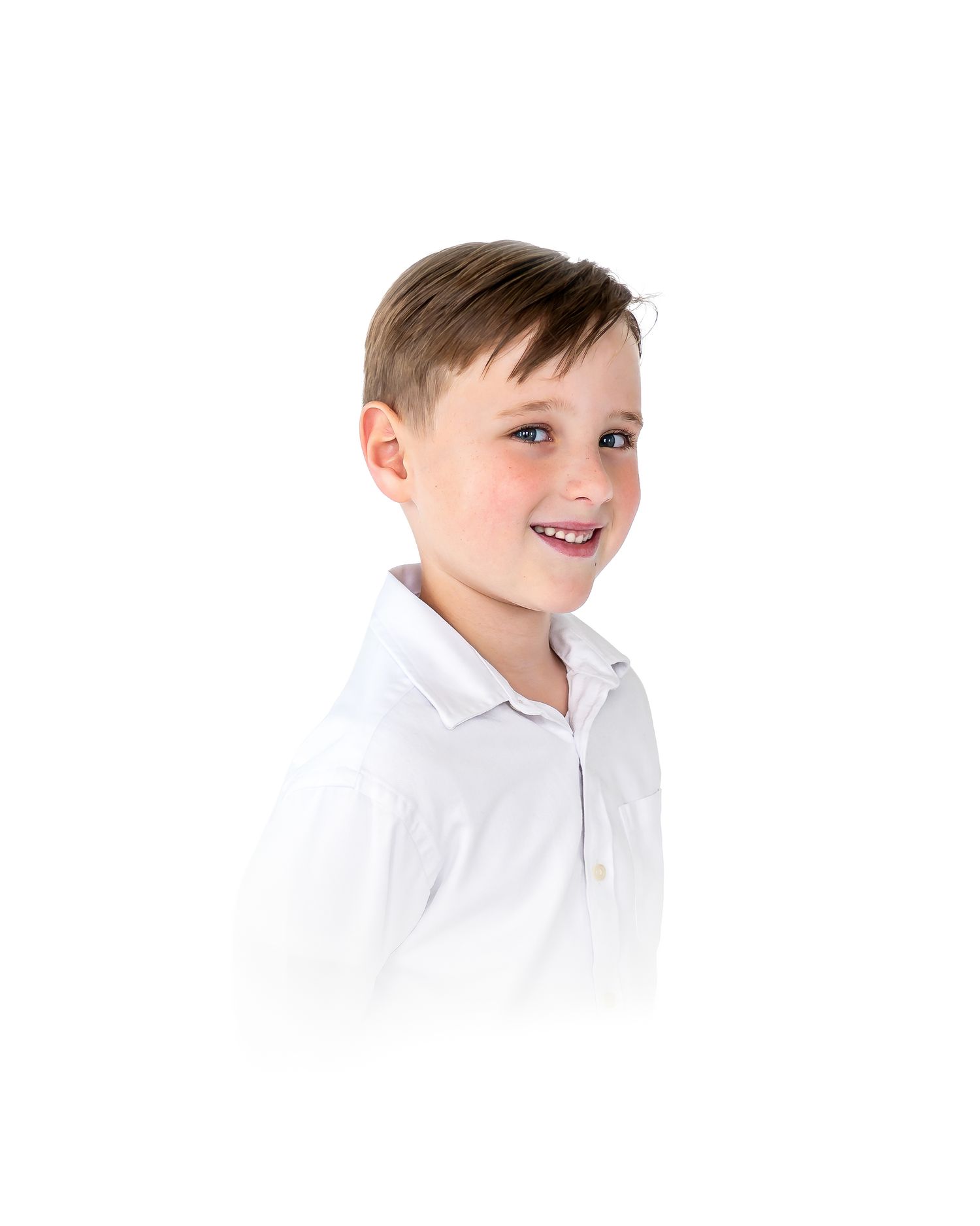 Smiling young boy with short brown hair wearing a white button-up shirt, photographed against a white background.
