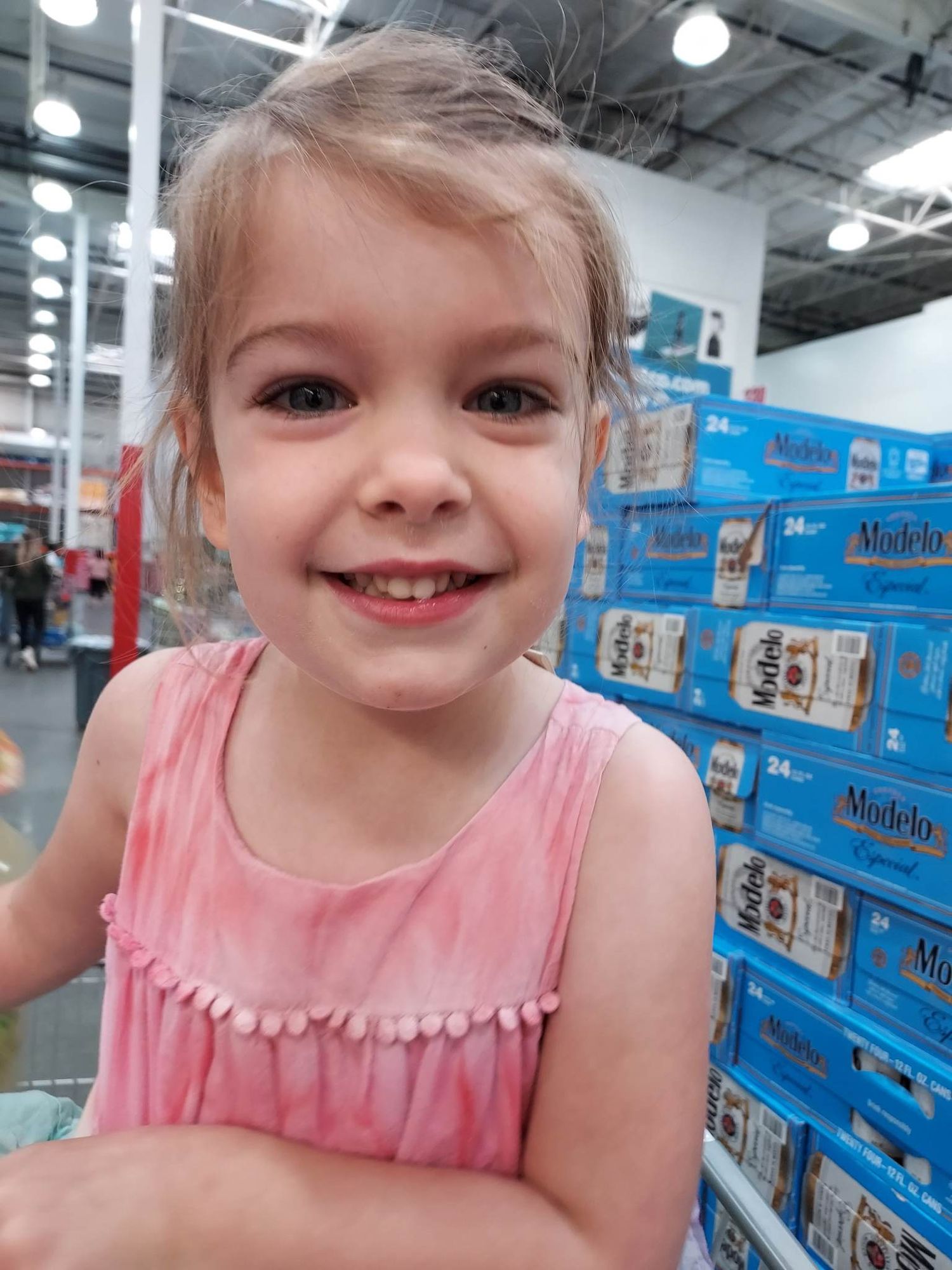 Four year old Jenny sits with a toy with a photo taken at eye level