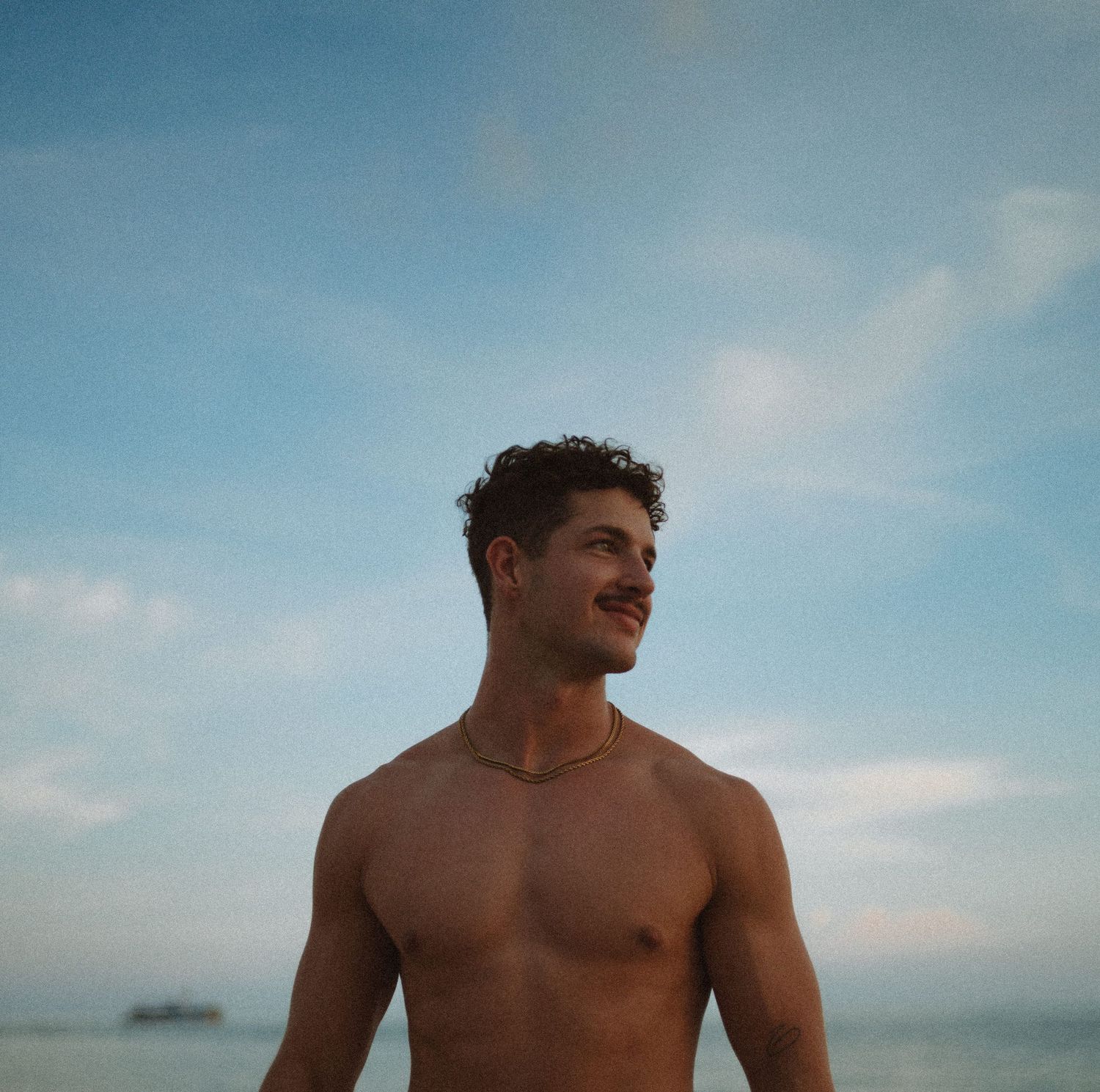 Capturing beach senior photos in Key West with golden light, ocean views, and natural coastal backdrops