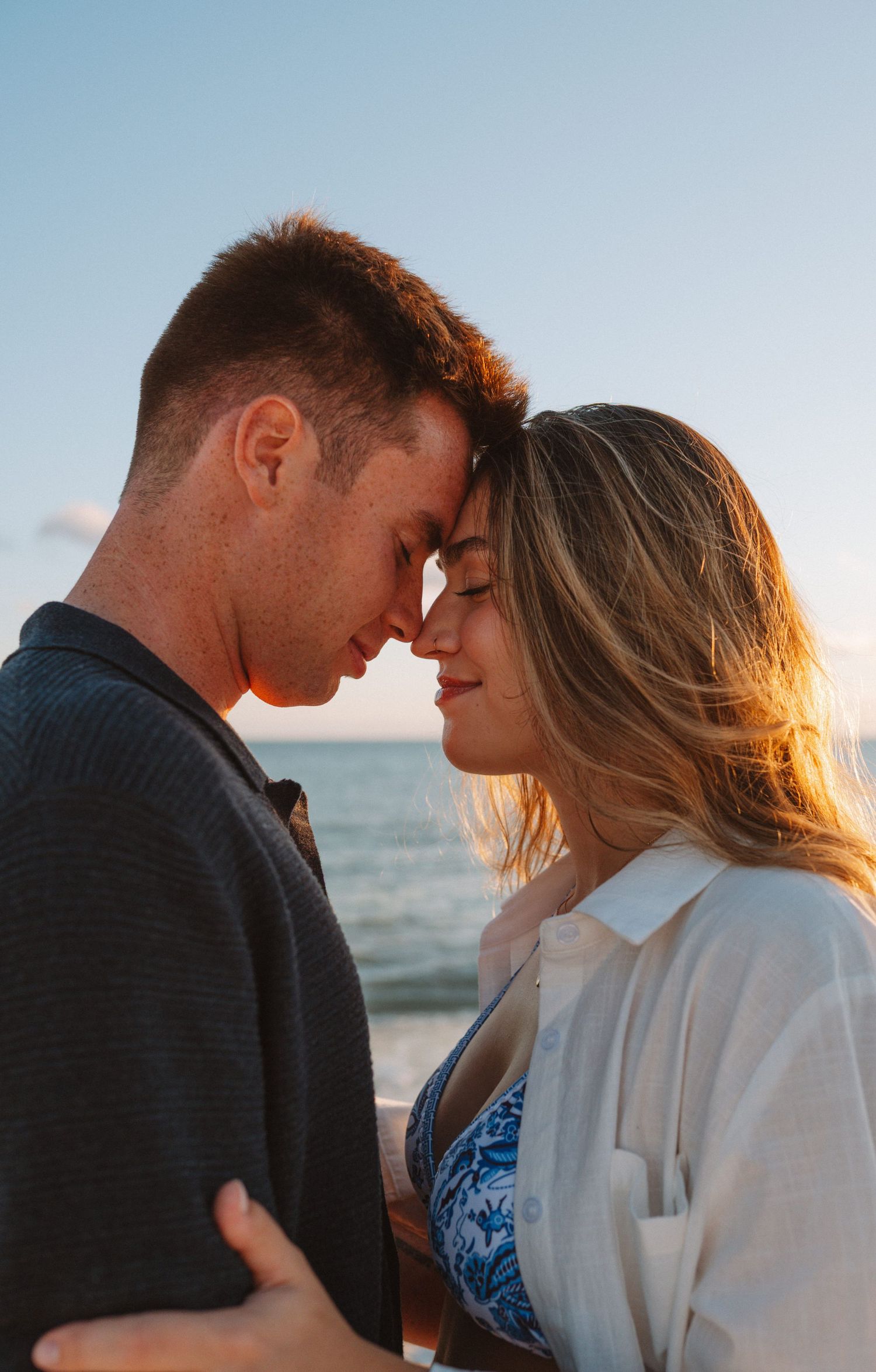 Key West couples photographer capturing romantic beach engagement photos at sunset in the Florida Keys