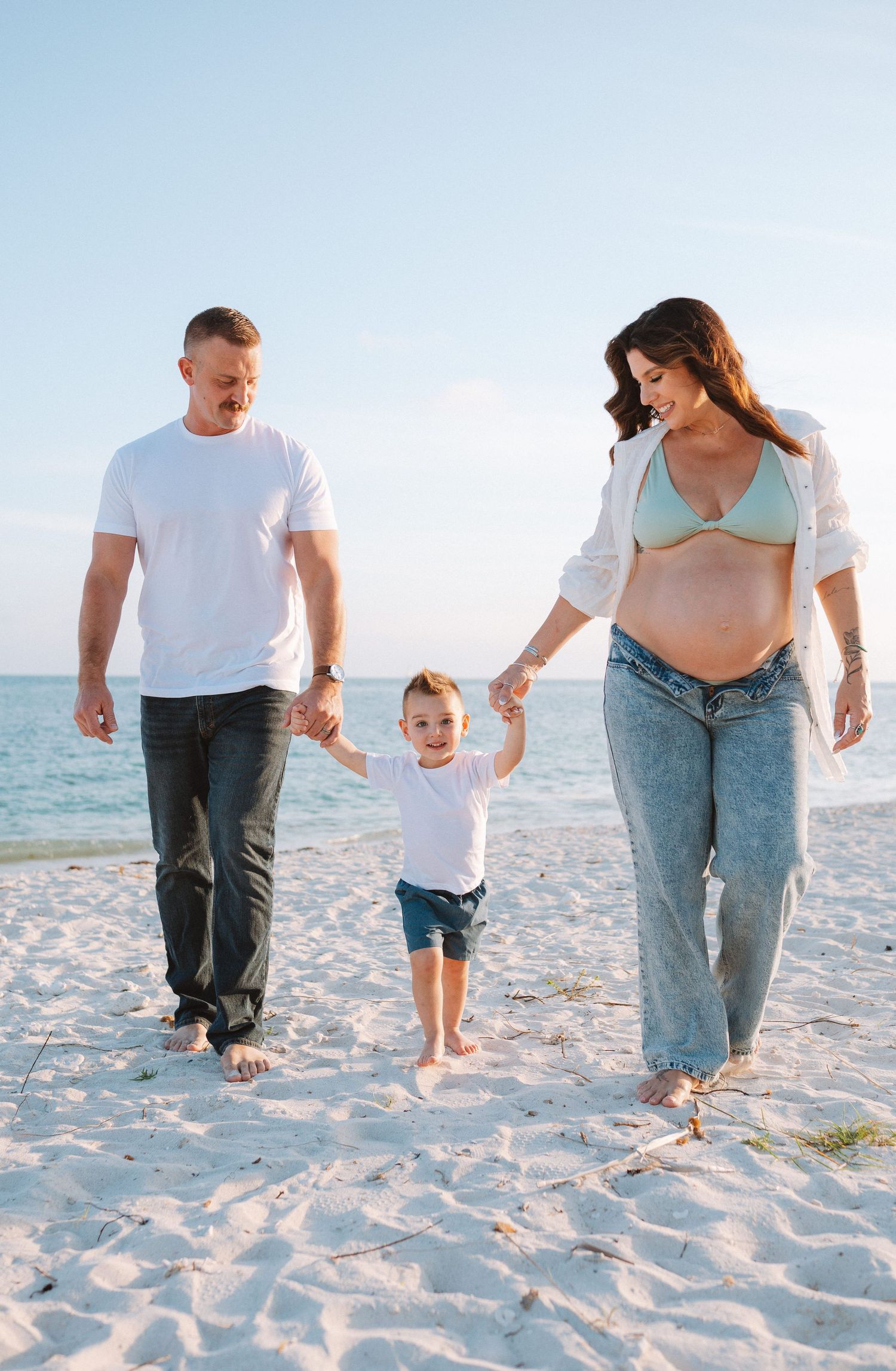 Key West family photographer documenting beach photo sessions with warm sunset light and ocean views