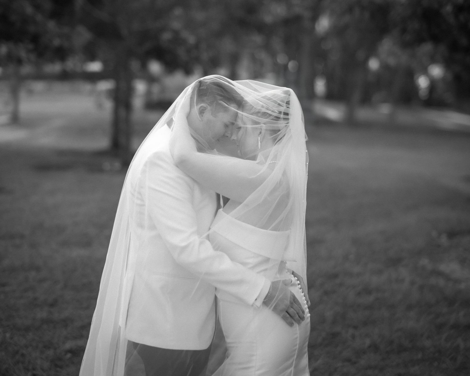 Wedding couple photographed in natural light
Bride and groom embracing during wedding day
Candid moment from a Florida wedding