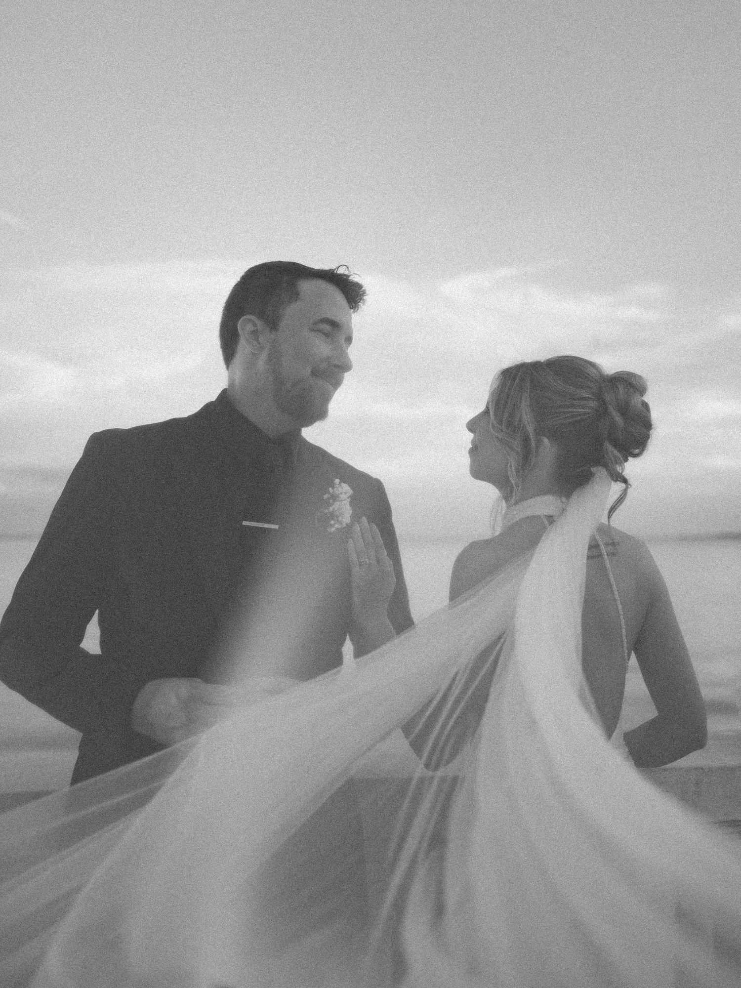 Wedding couple photographed in natural light
Bride and groom embracing during wedding day
Candid moment from a Florida wedding