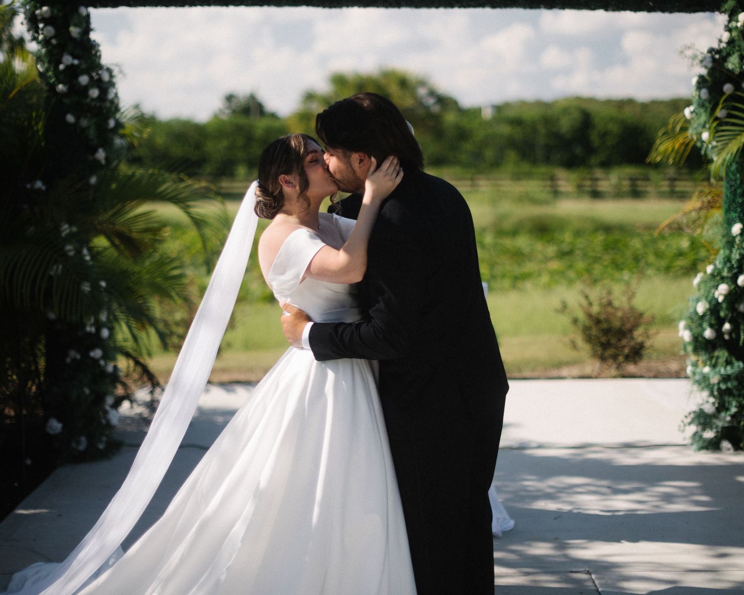 Wedding couple photographed in natural light
Bride and groom embracing during wedding day
Candid moment from a Florida wedding